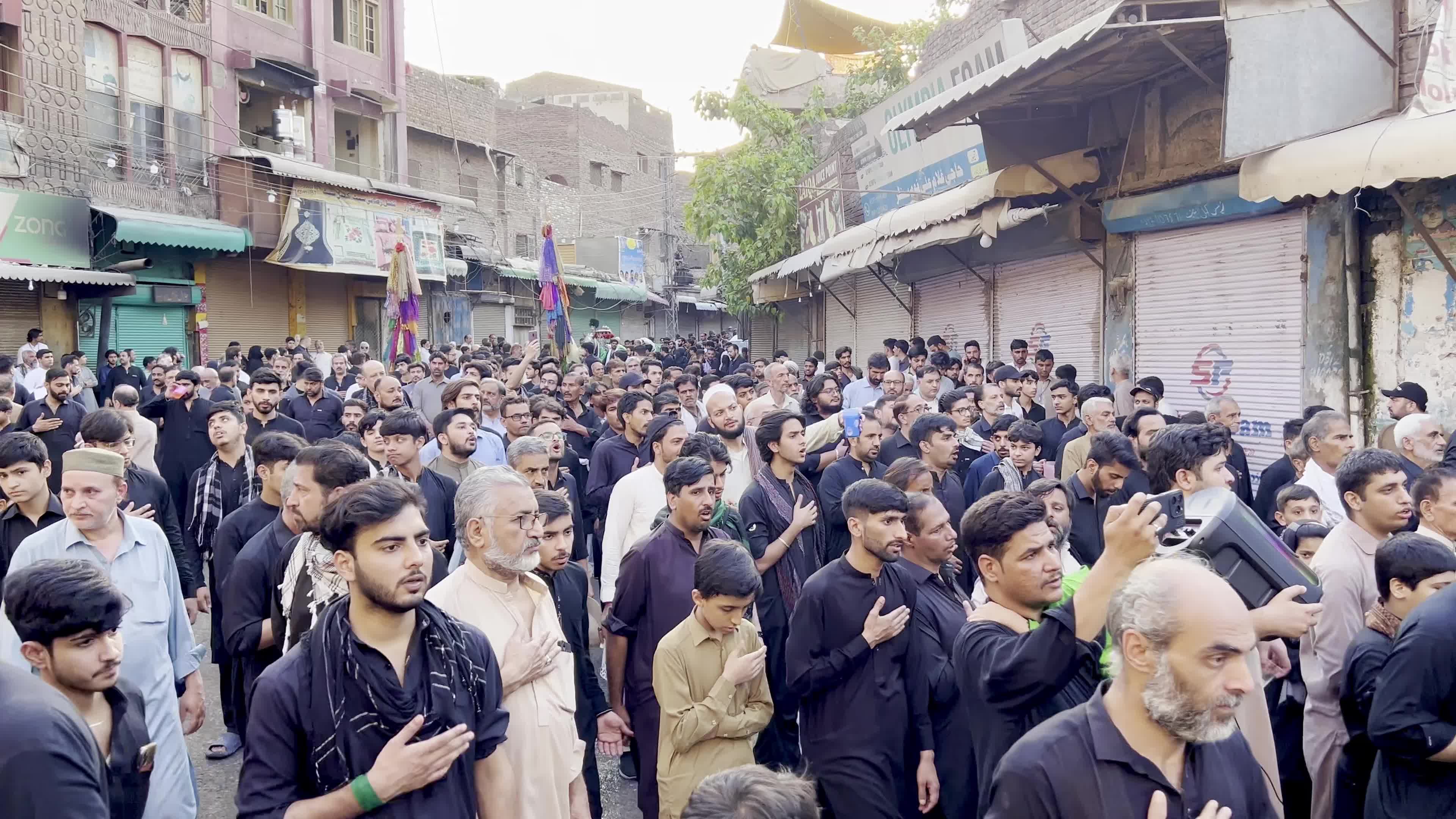 Shiite Muslim Mourners Participate in Religious Procession to Honor Imam Hussain (A.S.) and Remember the Martyrs of Karbala