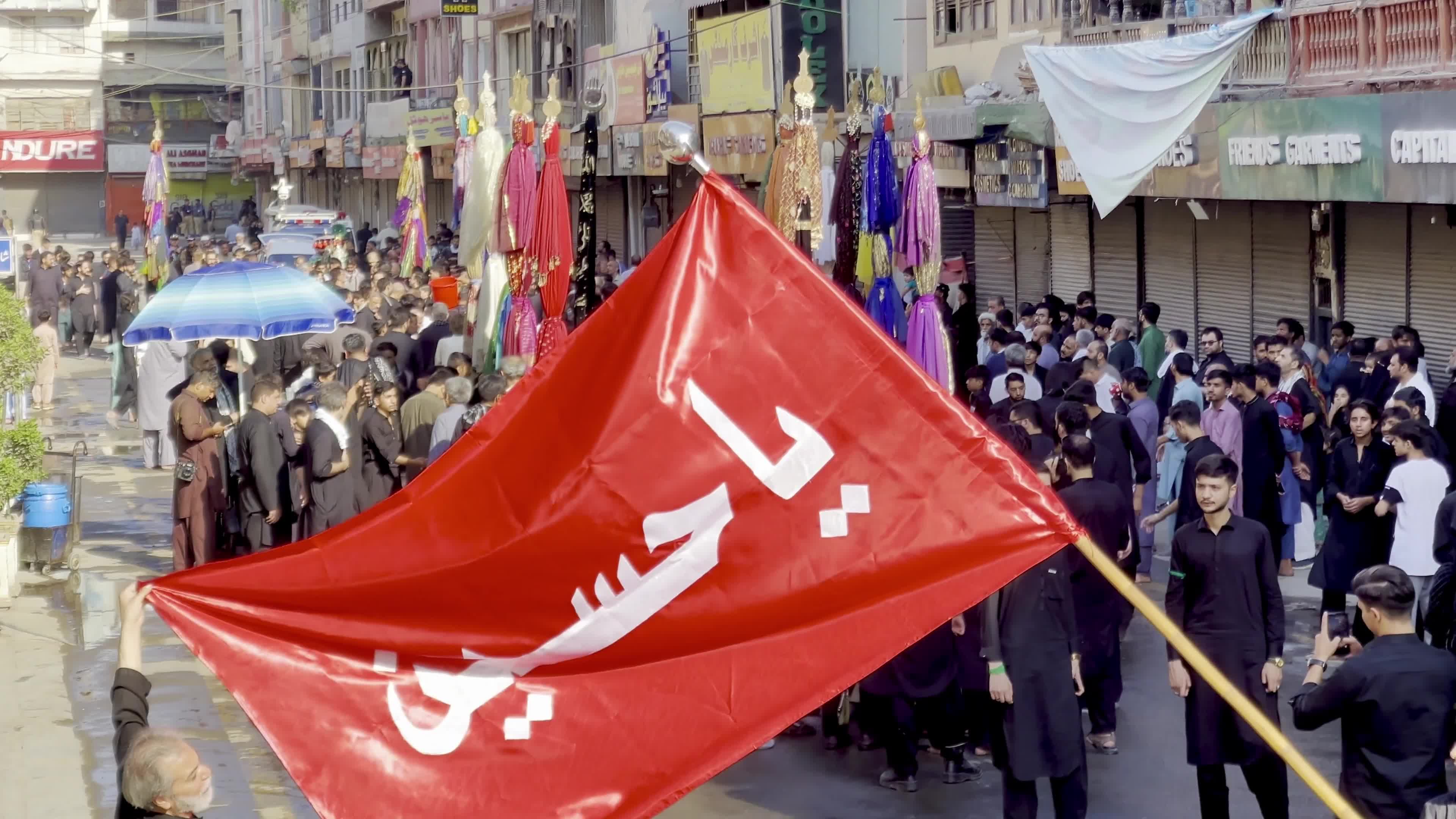 Shiite Muslim Mourners Participate in Religious Procession to Honor Imam Hussain (A.S.) and Remember the Martyrs of Karbala