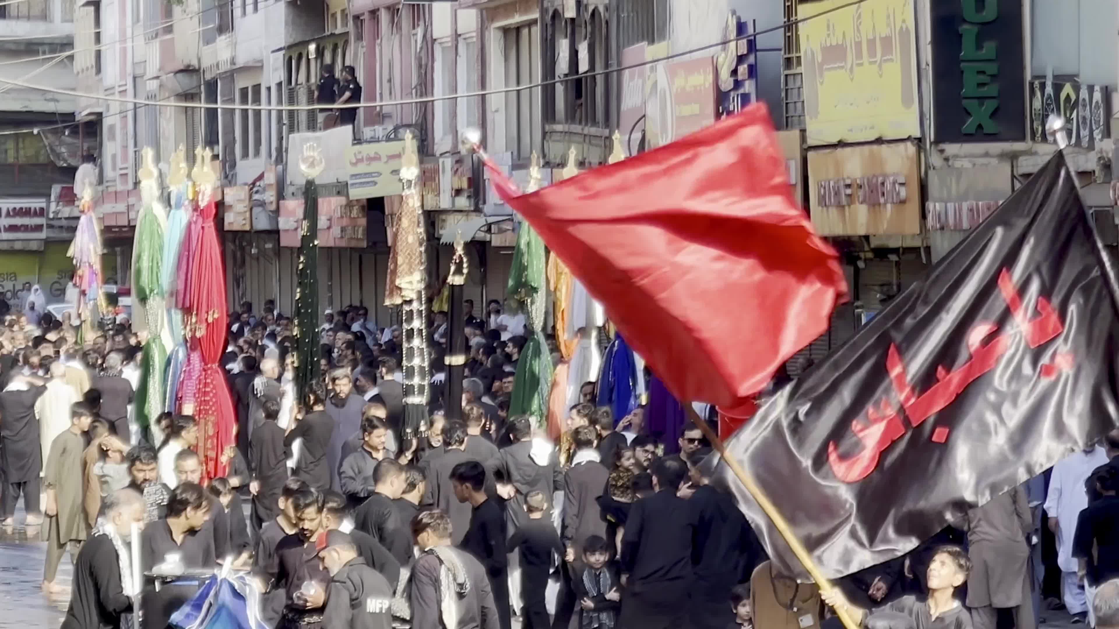 Shiite Muslim Mourners Participate in Religious Procession to Honor Imam Hussain (A.S.) and Remember the Martyrs of Karbala