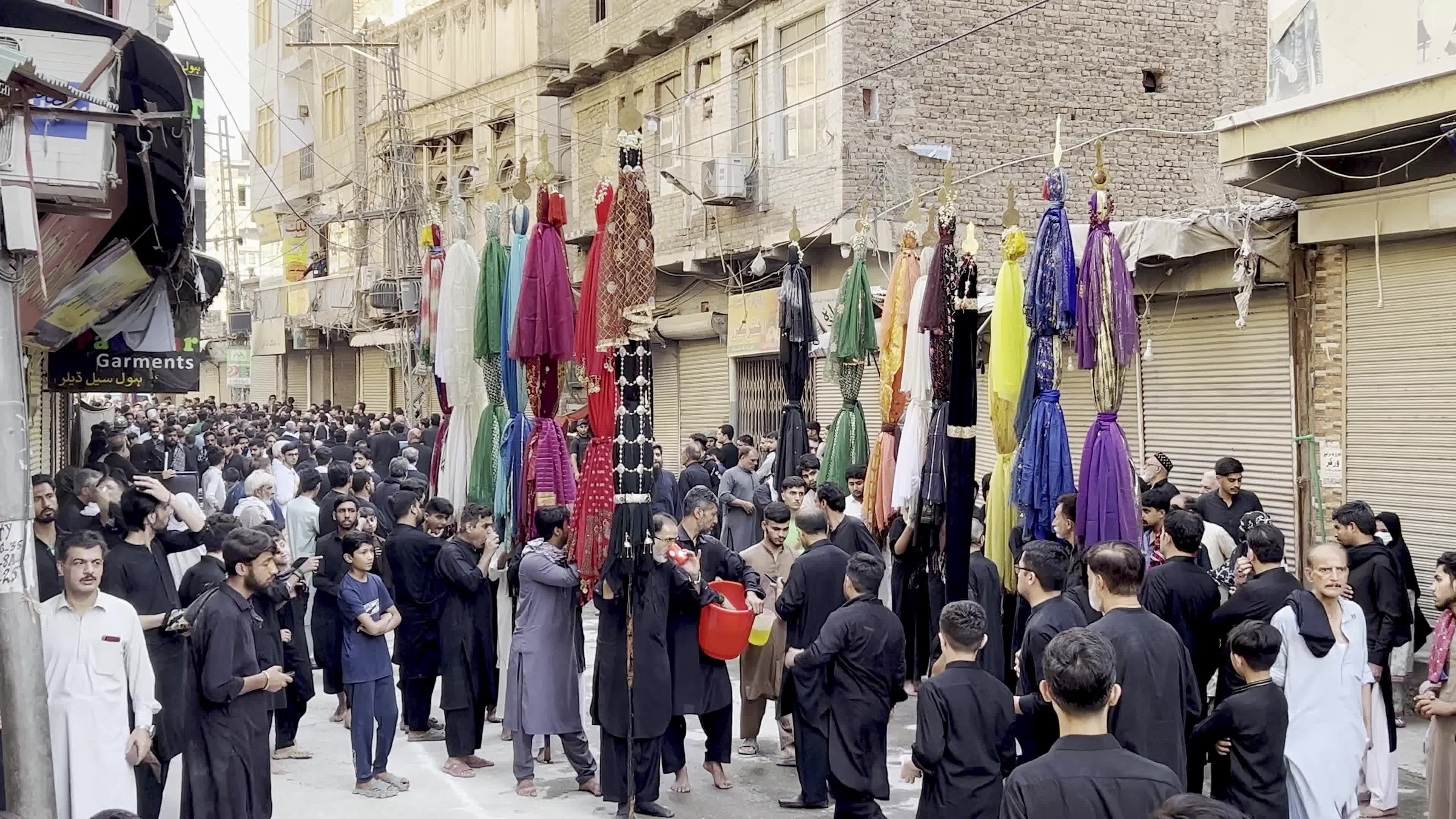 Shiite Muslim Mourners Participate in Religious Procession to Honor Imam Hussain (A.S.) and Remember the Martyrs of Karbala