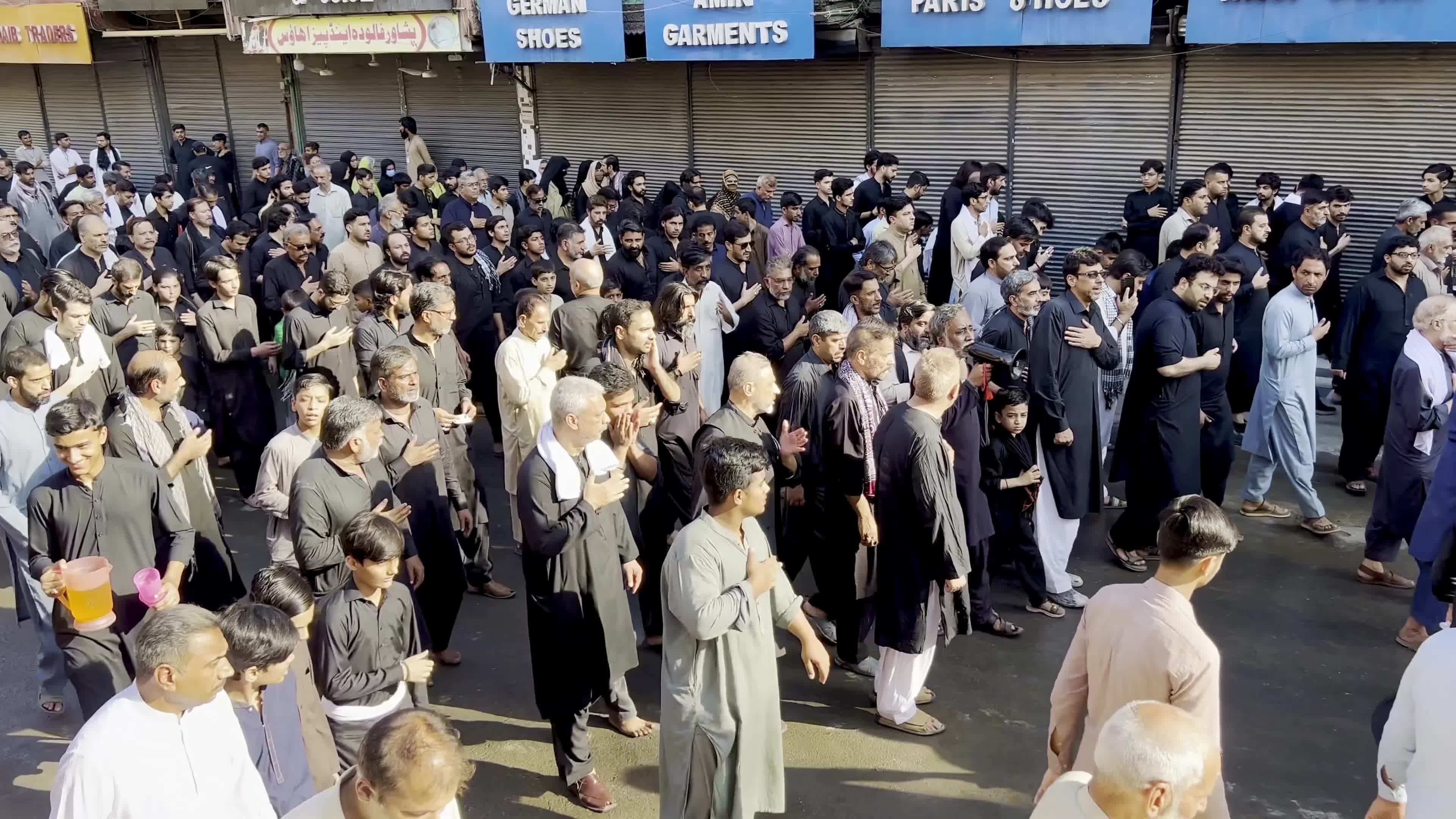 Shiite Muslim Mourners Participate in Religious Procession to Honor Imam Hussain (A.S.) and Remember the Martyrs of Karbala