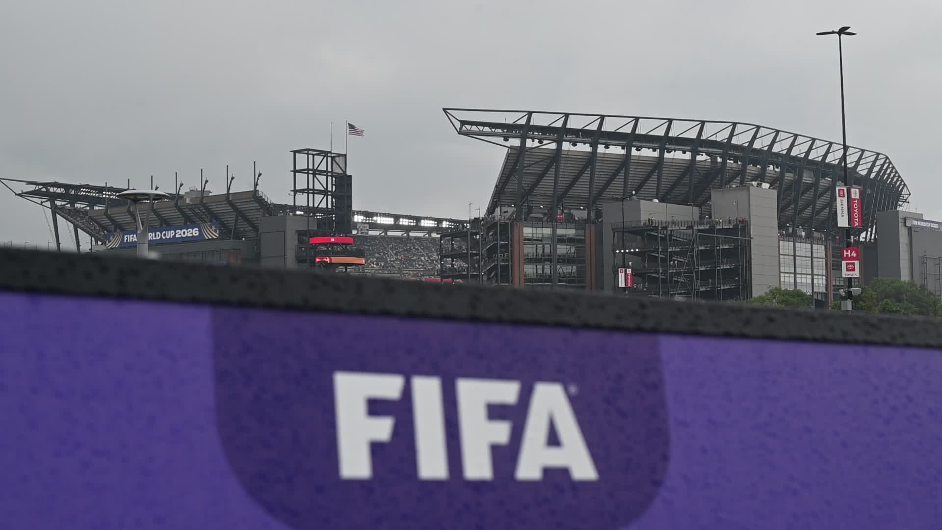 Football Supporter Arrive at Philadelphia Stadium on a Rainy Day