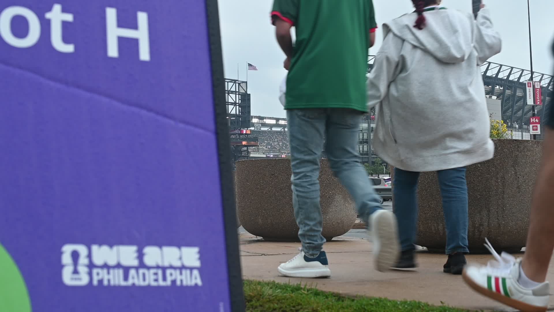 Football Supporter Arrive at Philadelphia Stadium on a Rainy Day