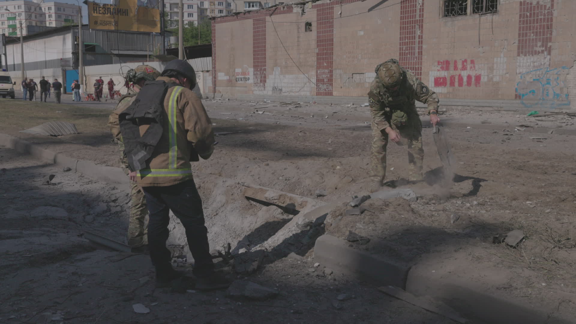 Ukrainian emergency responders work at scene of attack in Kharkiv that killed one, wounded ten