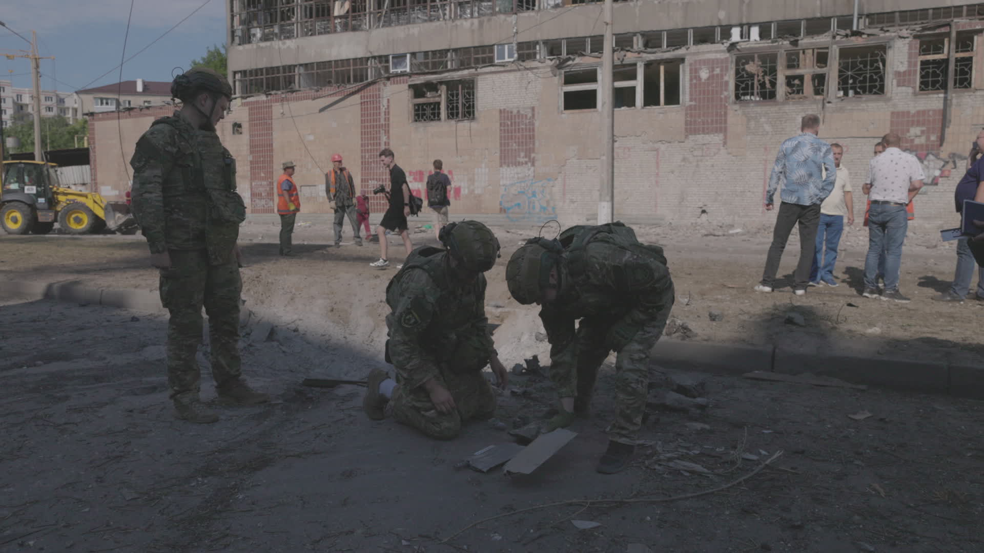 Ukrainian emergency responders work at scene of attack in Kharkiv that killed one, wounded ten