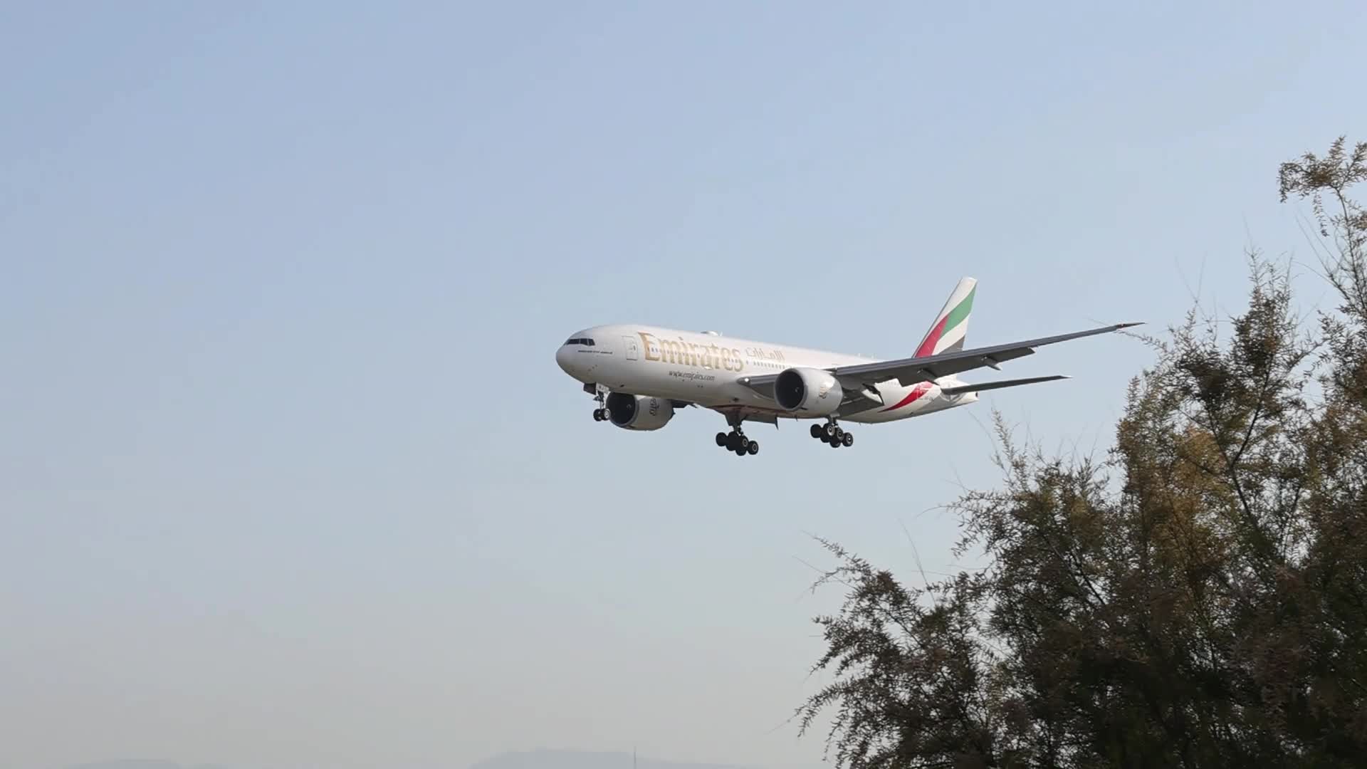An Emirates Boeing 777 lands at Barcelona Airport