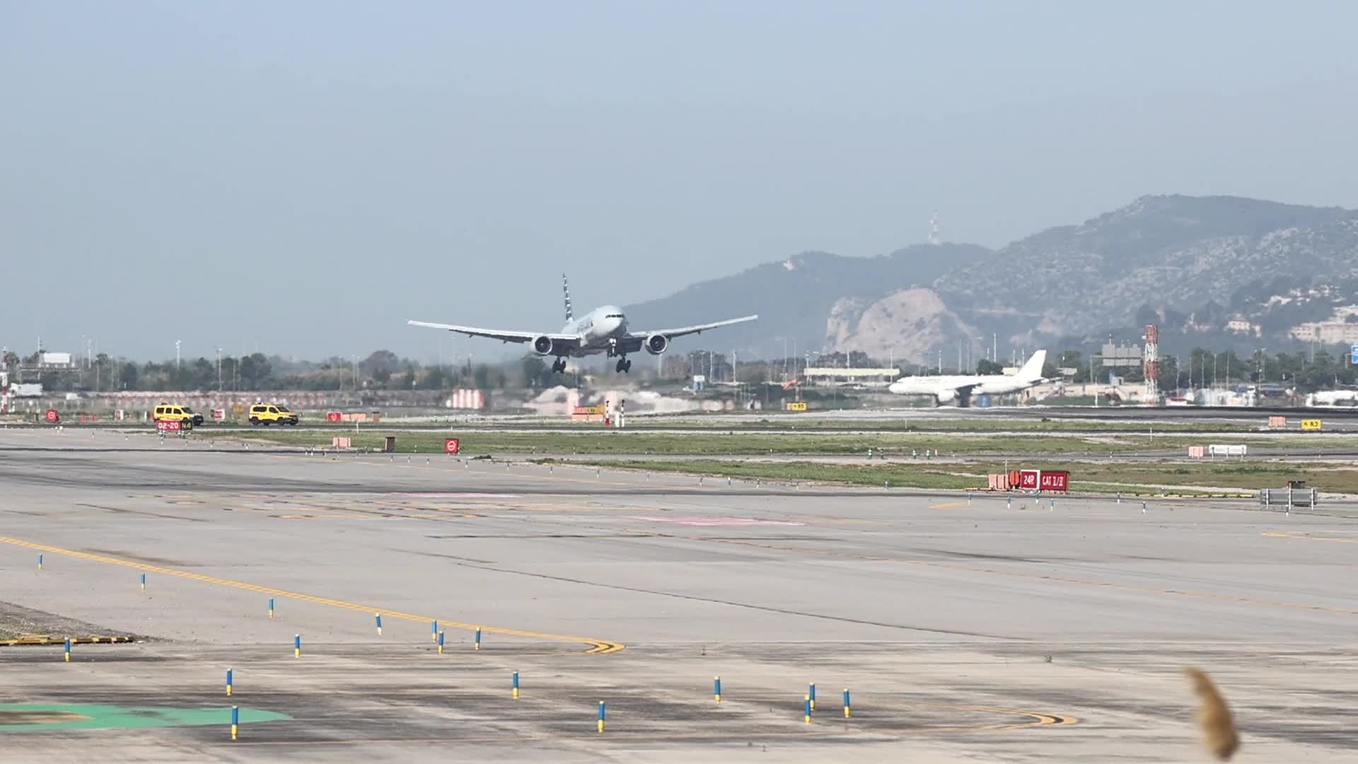 An American Airlines Boeing 777 lands at Barcelona Airport