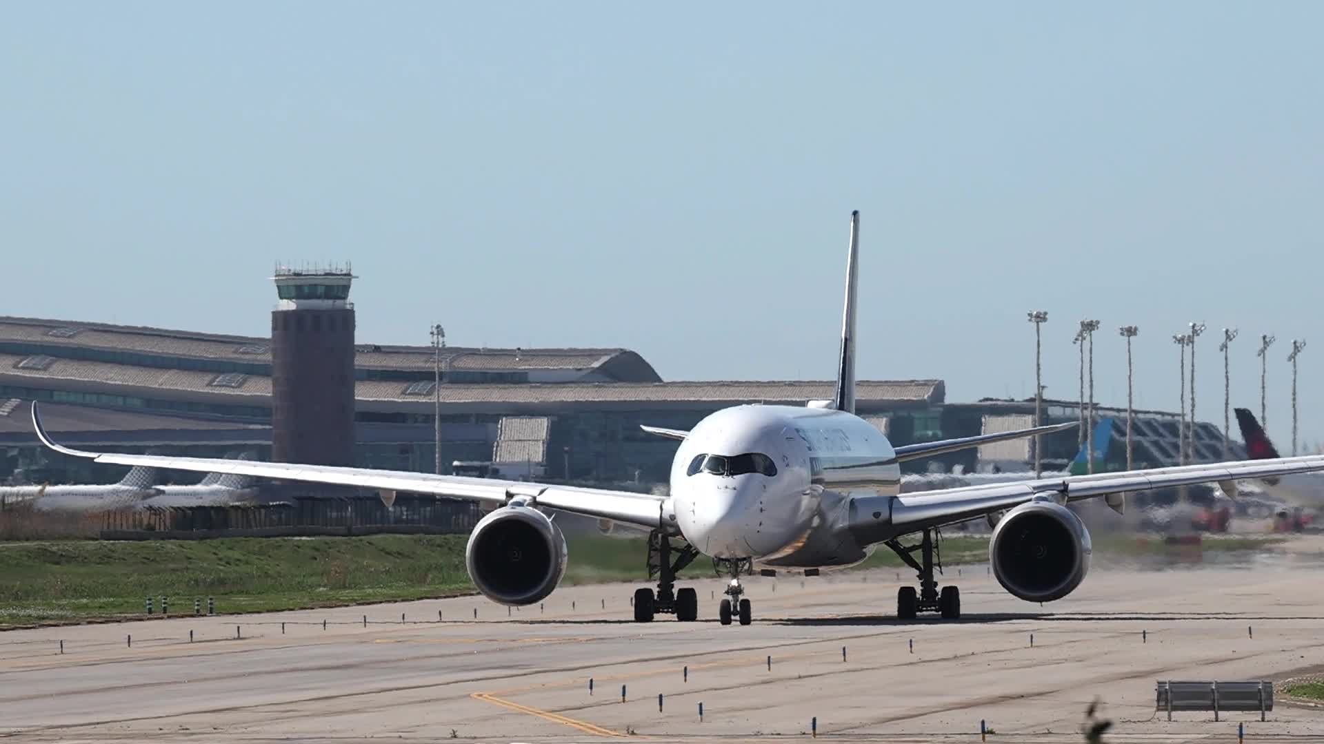 A Singapore Airlines Airbus A350 takes off from Barcelona Airport