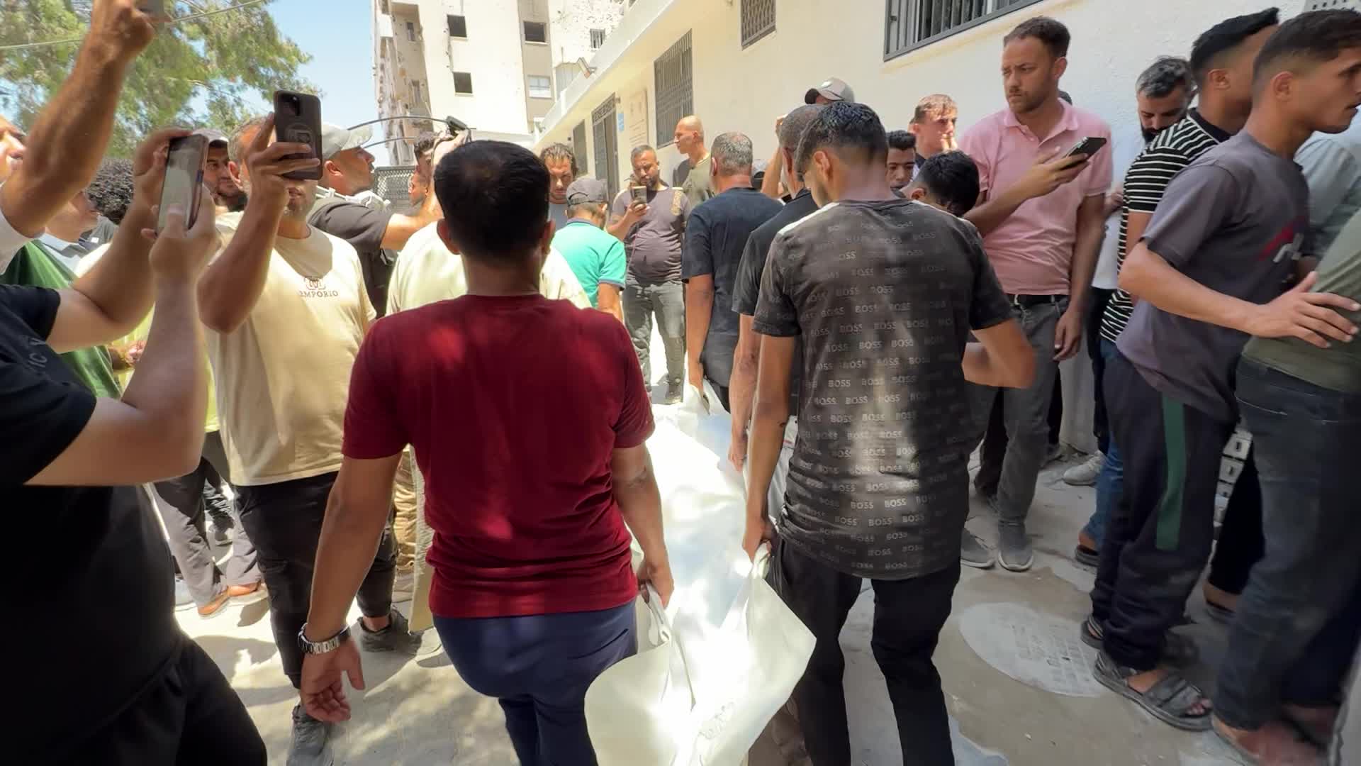 Mourners participate in the funeral of six Palestinian police officers in Gaza City