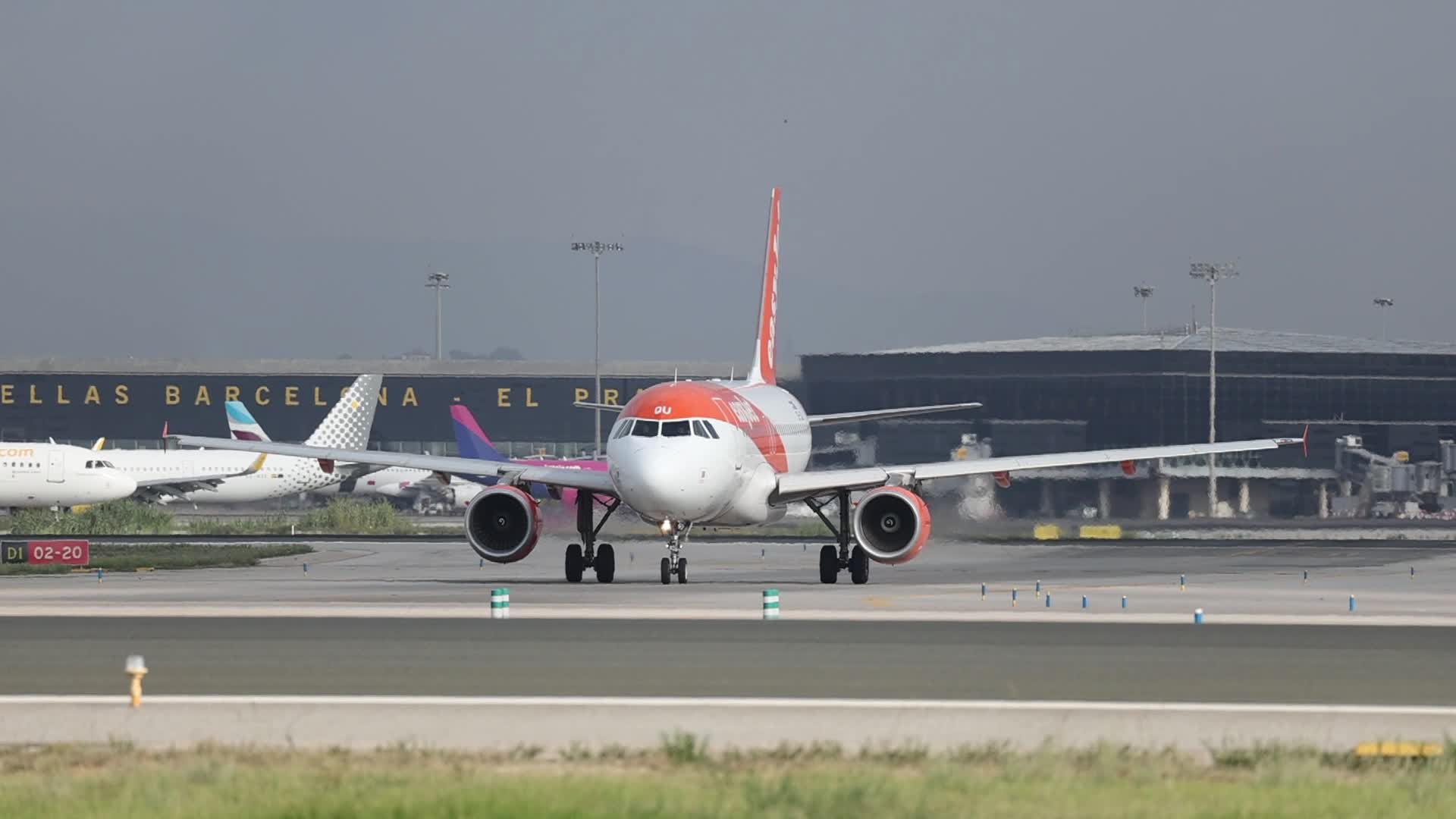 An EasyJet Airbus A319 on the runway at Barcelona Airport