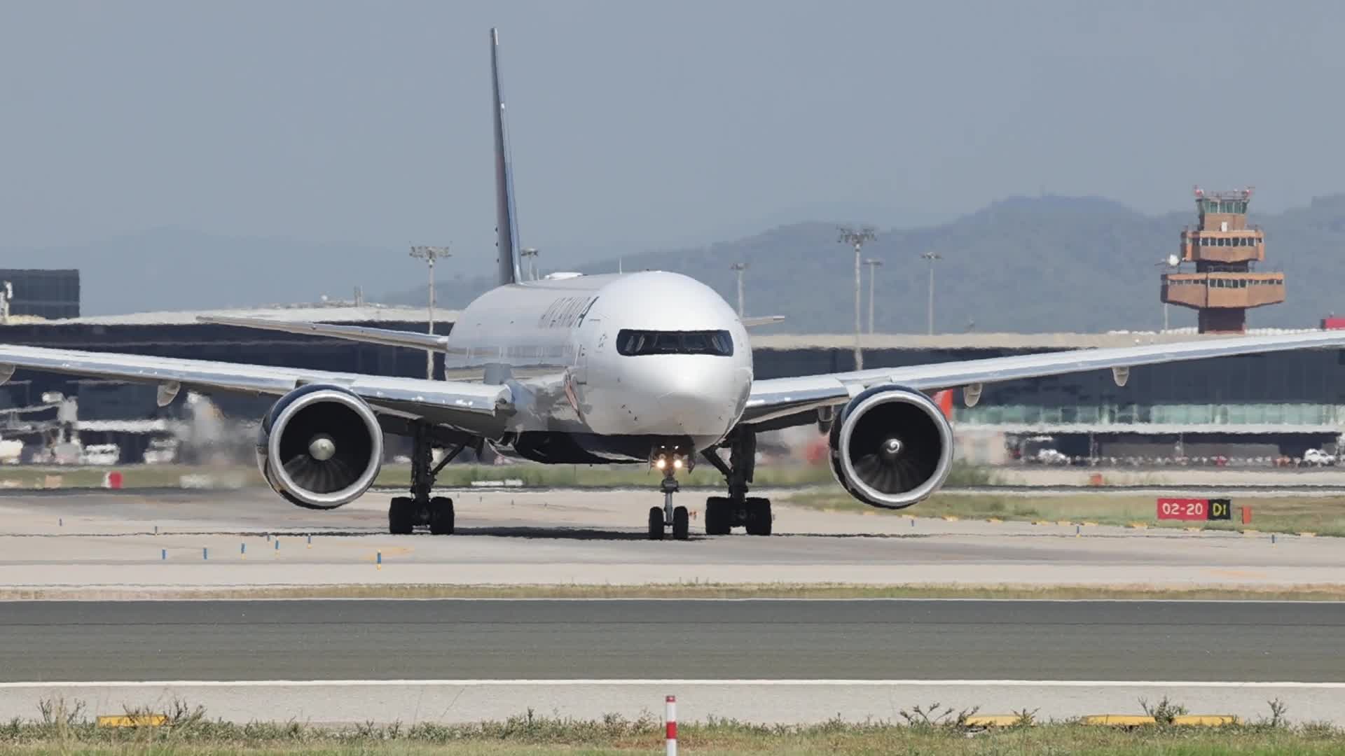 An Air Canada Boeing 777 takes off from Barcelona Airport