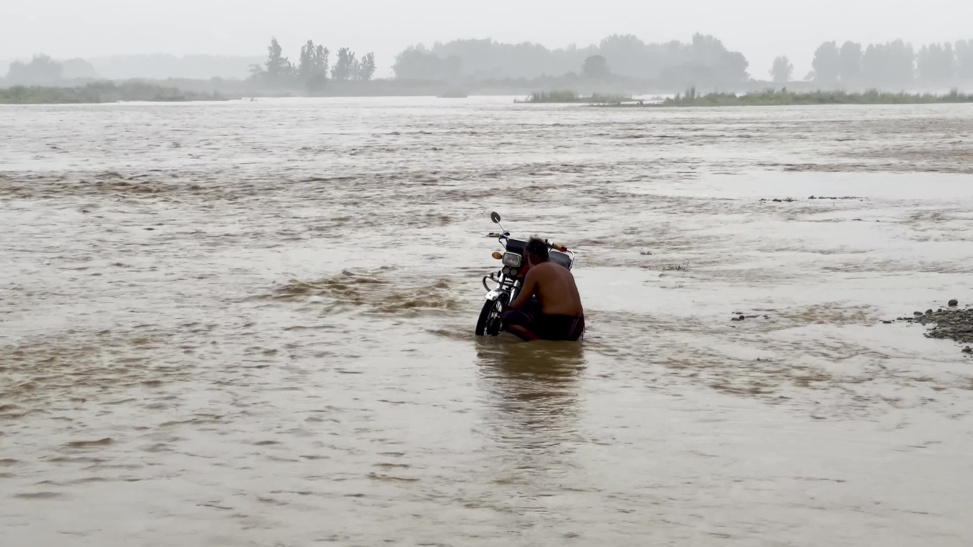 High-Level Flood Surge Moves Through Kabul River in Pakistan's Charsadda District