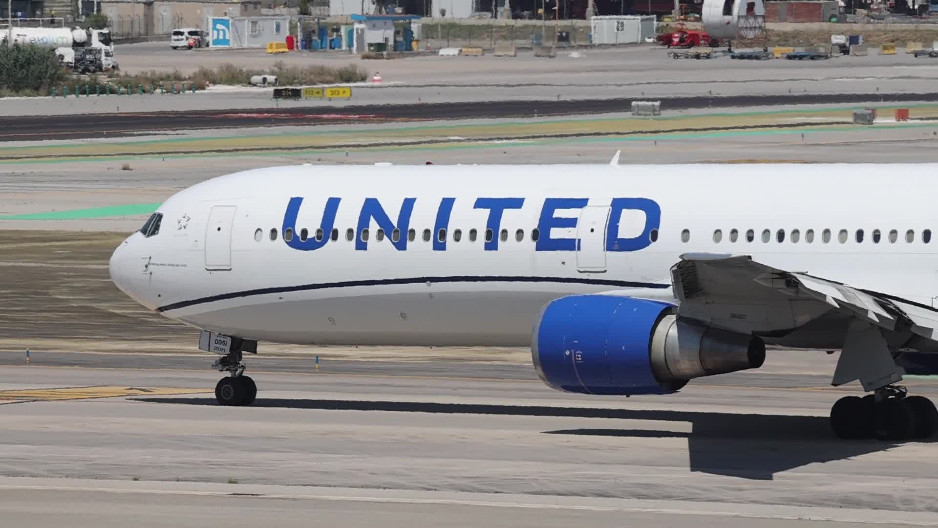 A United Airlines Boeing 767 and a Delta Air Lines Airbus A330 maneuvering at Barcelona Airport