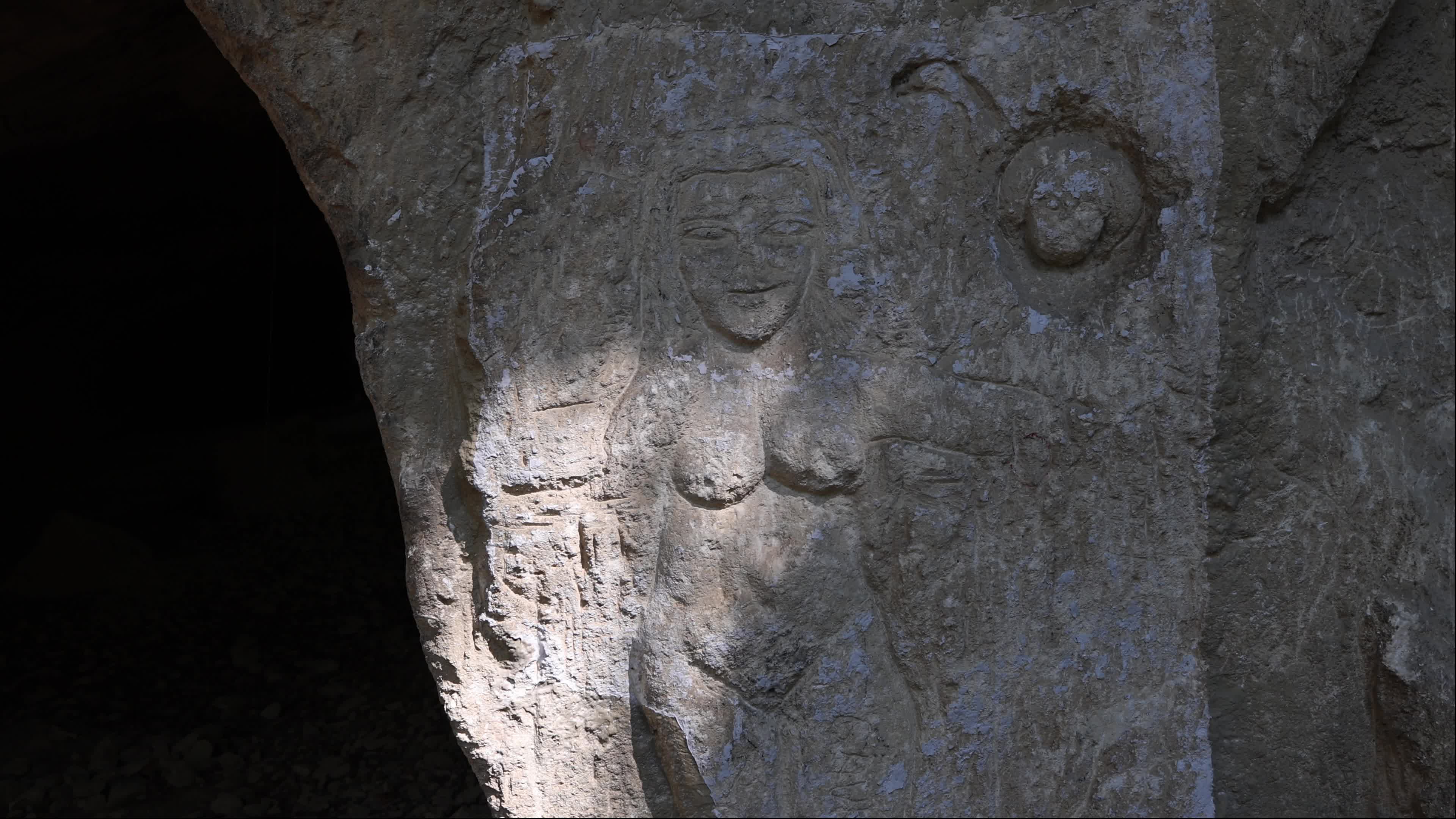 Image of a Woman Carved into Rock
