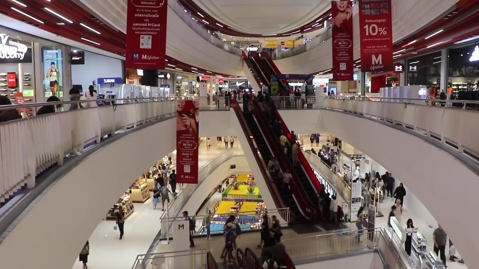 Tourists walk as they shop in the shopping mall in Bangkok. - 07/29/2026