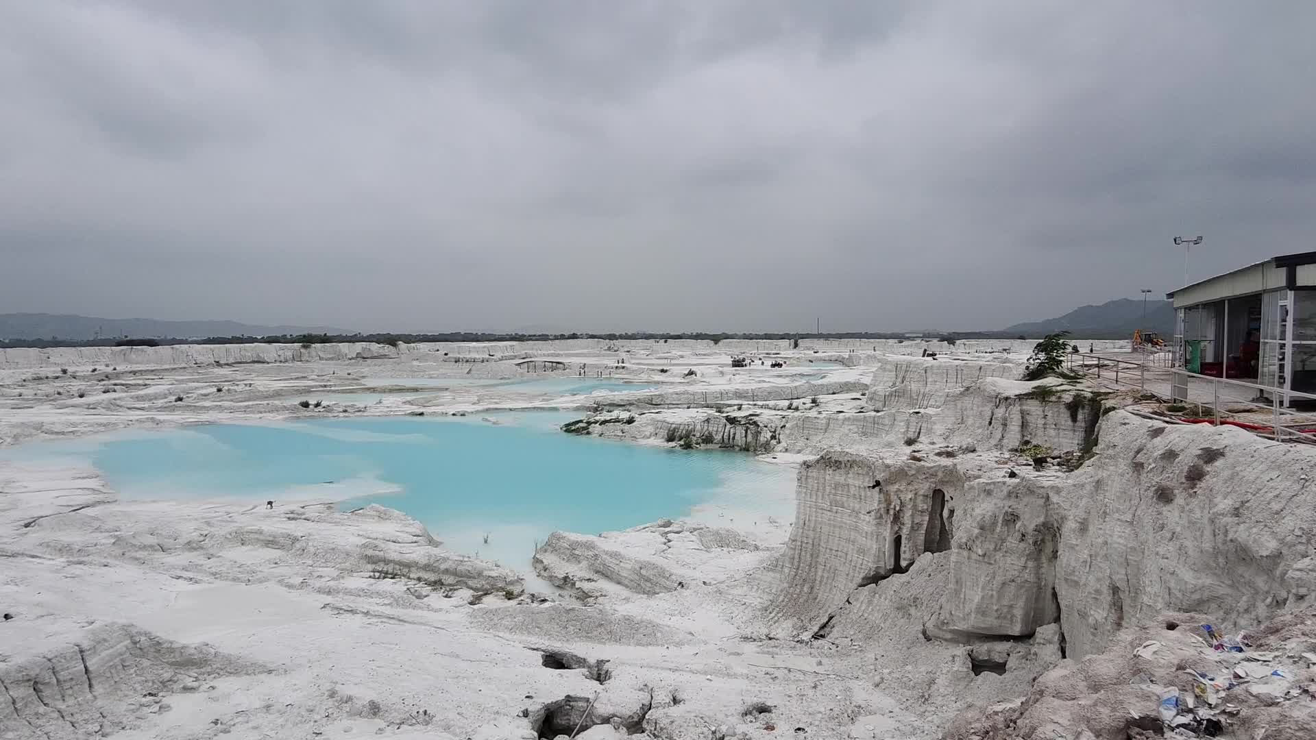 Indian Tourists enjoy at the Marble Slurry dumping yard in Kishangarh, Near Ajmer, Rajasthan India on 07 August 2026.