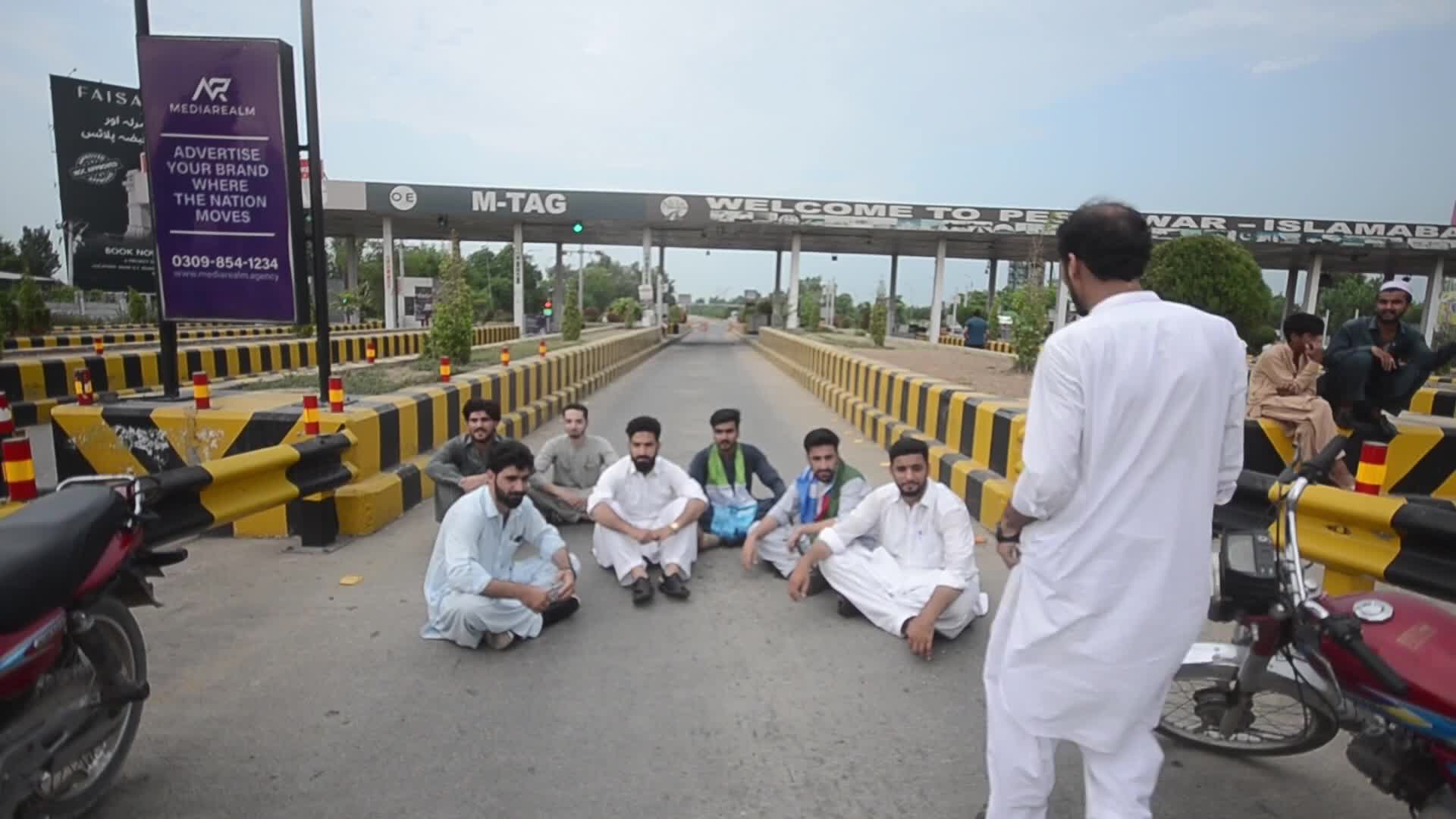 Jamaat-e-Islami Workers Block Peshawar Toll Plaza During Nationwide Wheel-Jam Strike