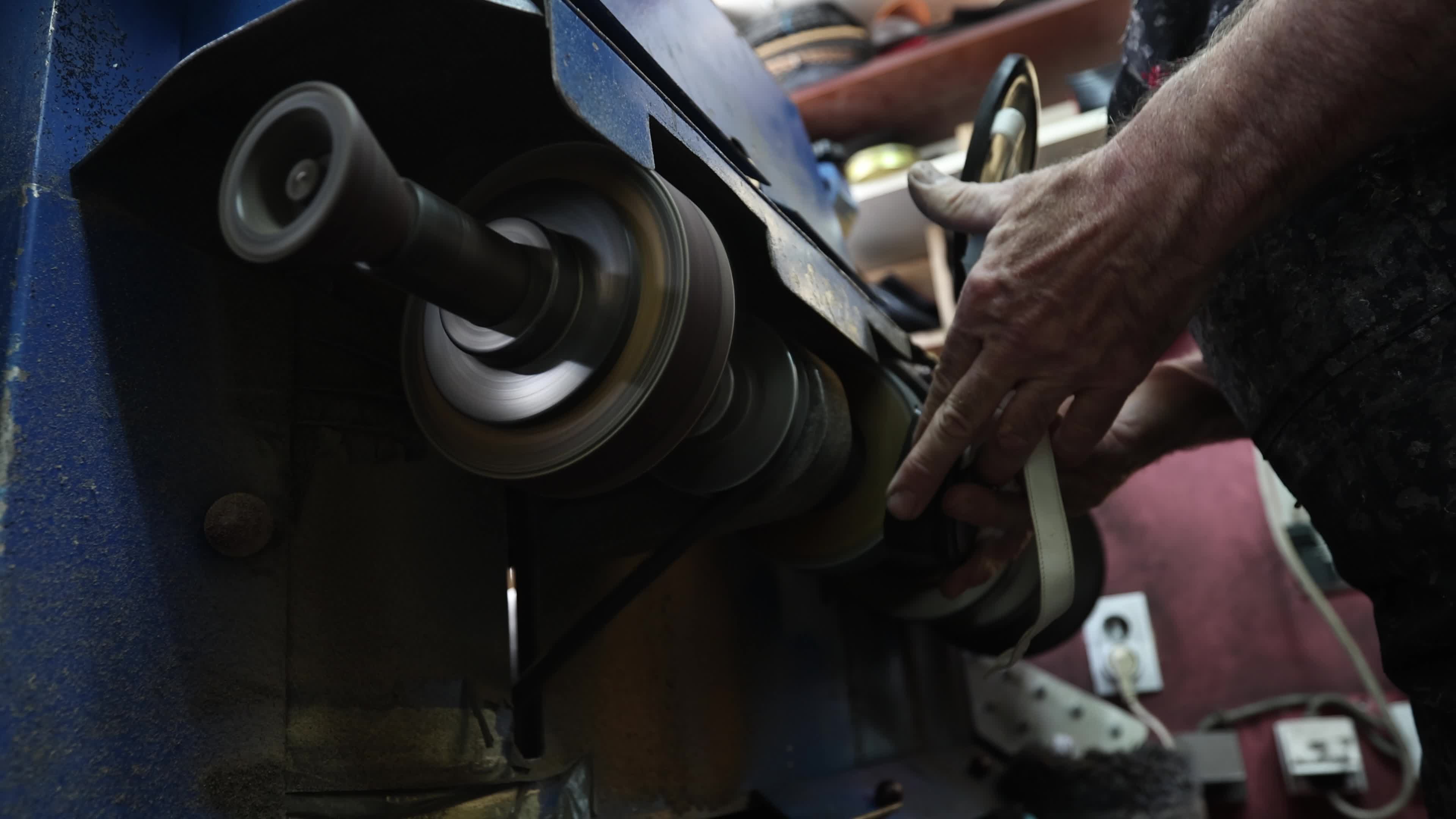 Shoemaker Working on a Grinding Machine in His Workshop