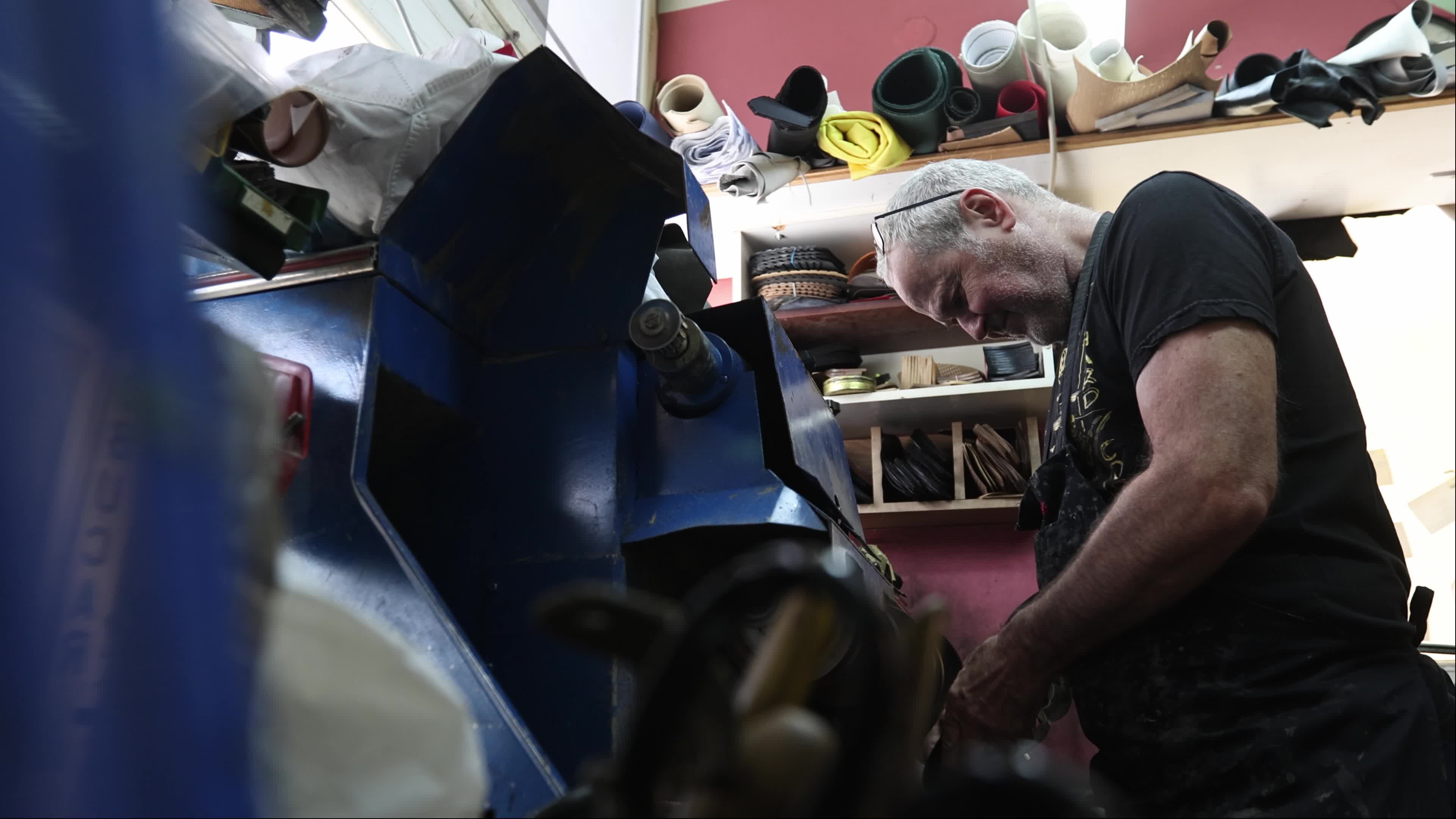 Shoemaker Working on a Grinding Machine in His Workshop
