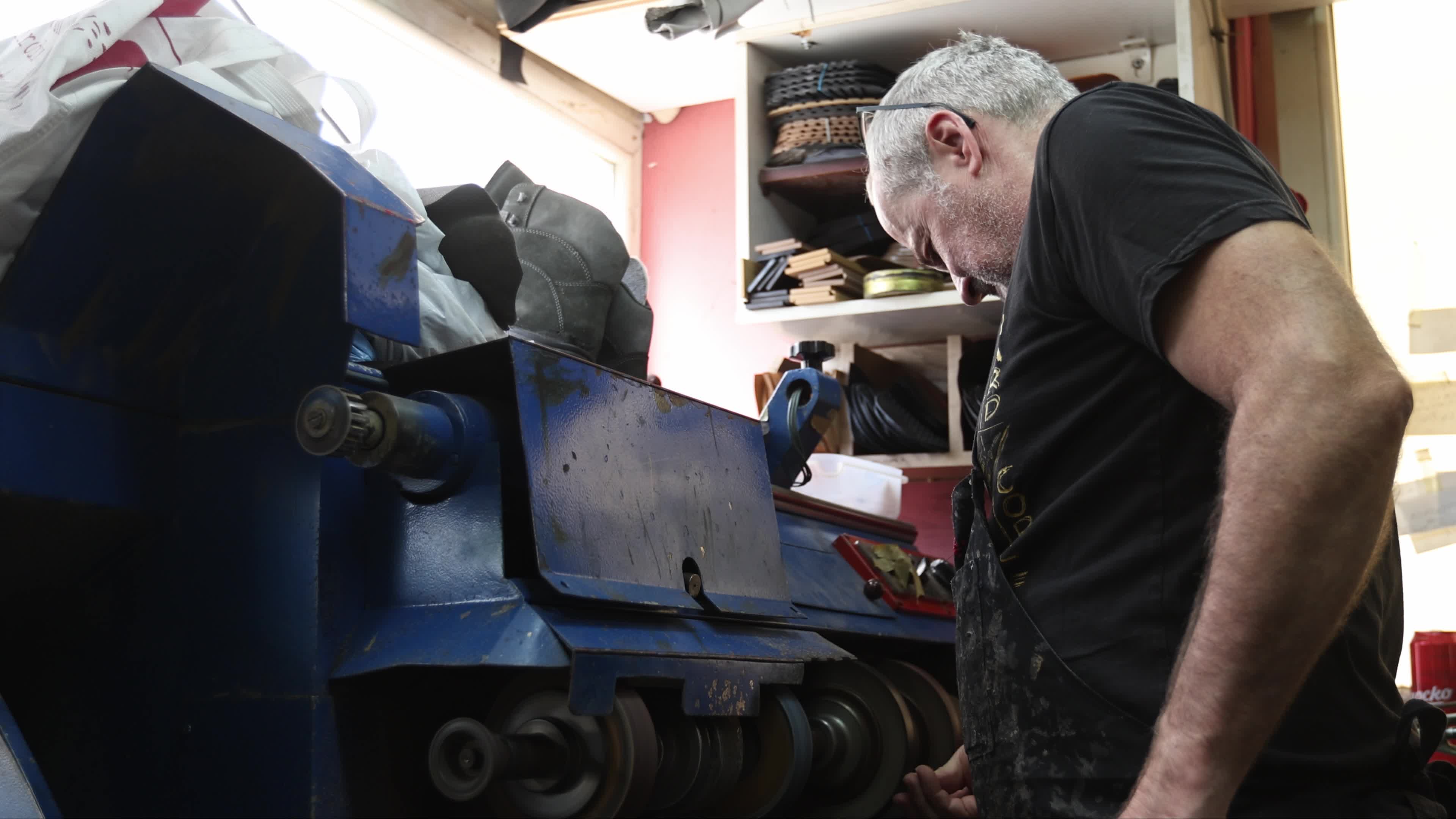 Shoemaker Working on a Grinding Machine in His Workshop