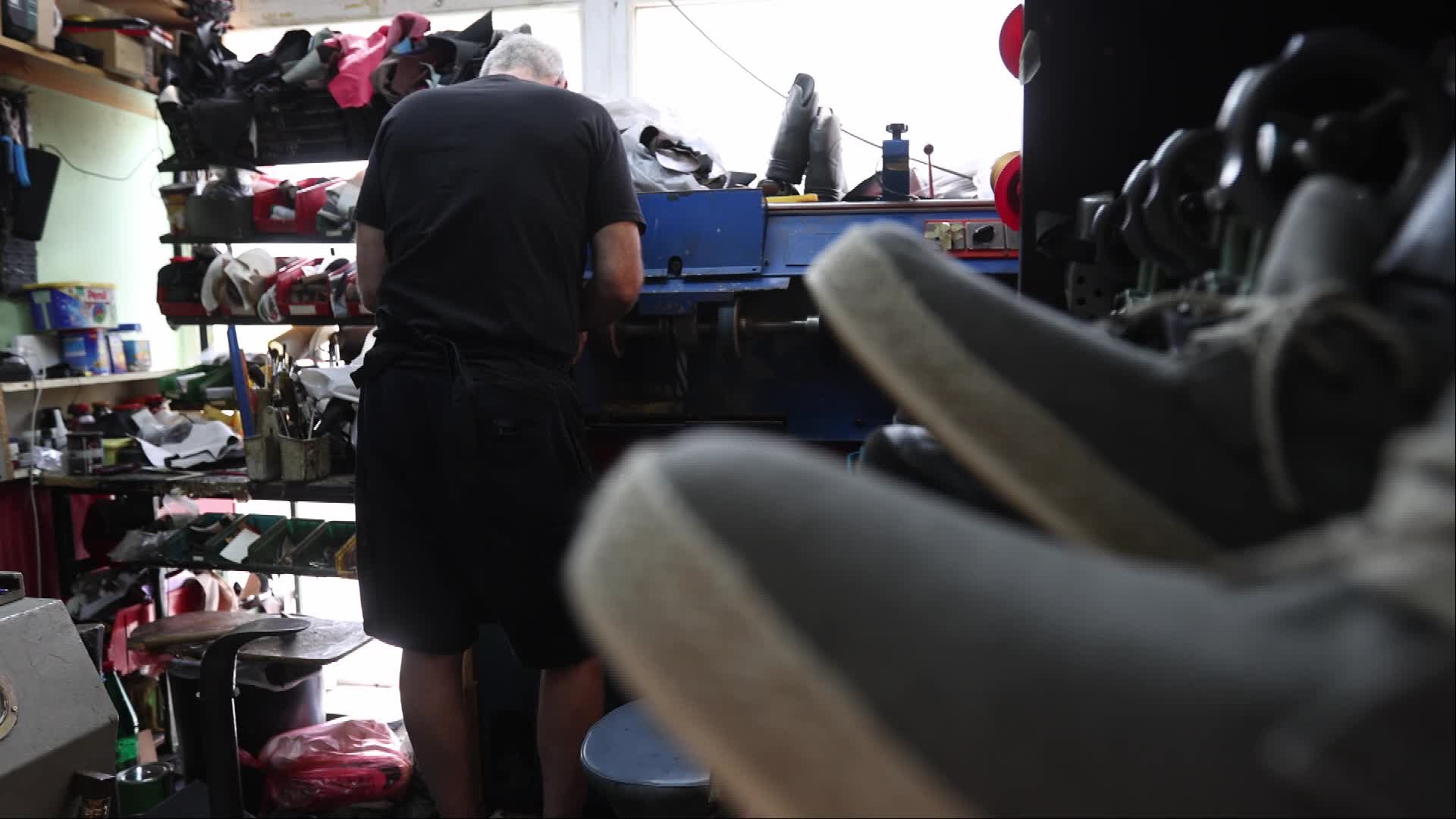 Shoemaker Working on a Grinding Machine in His Workshop - 08/21/2026