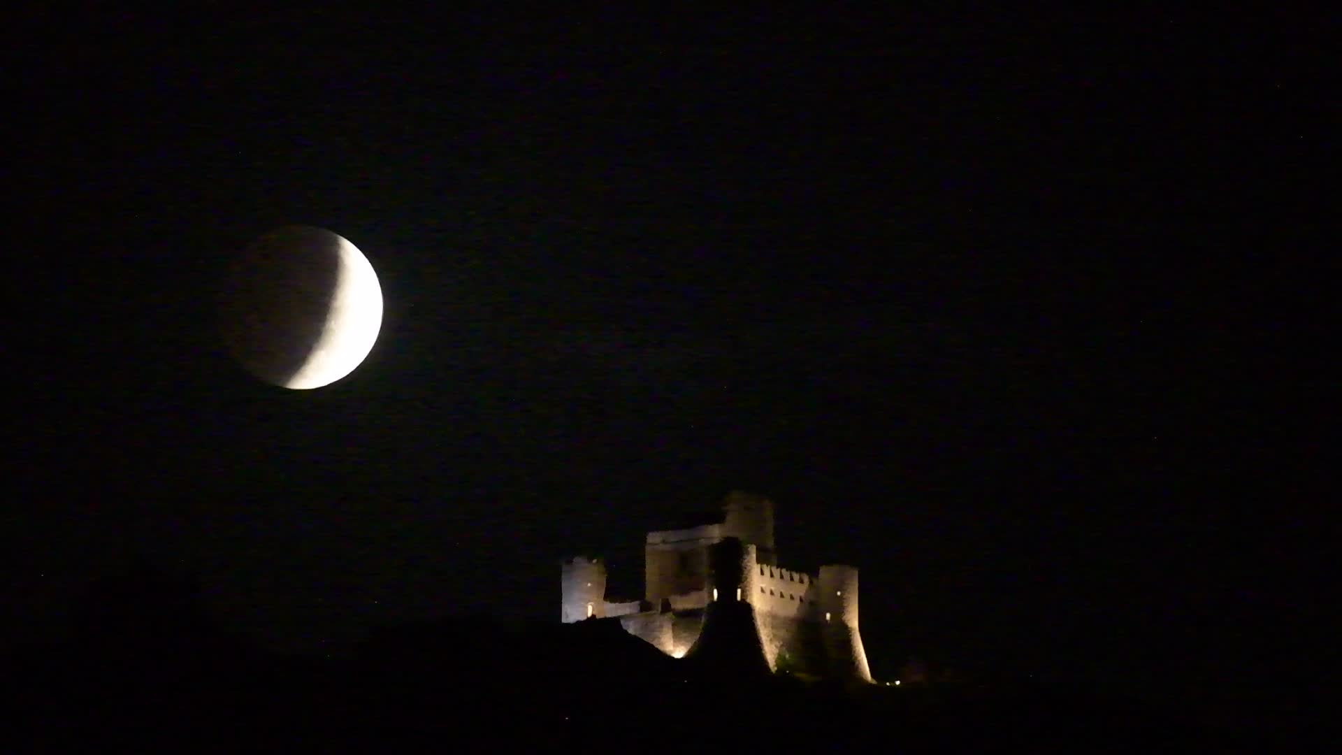 Partial Lunar Eclipse Over Calascio, Italy