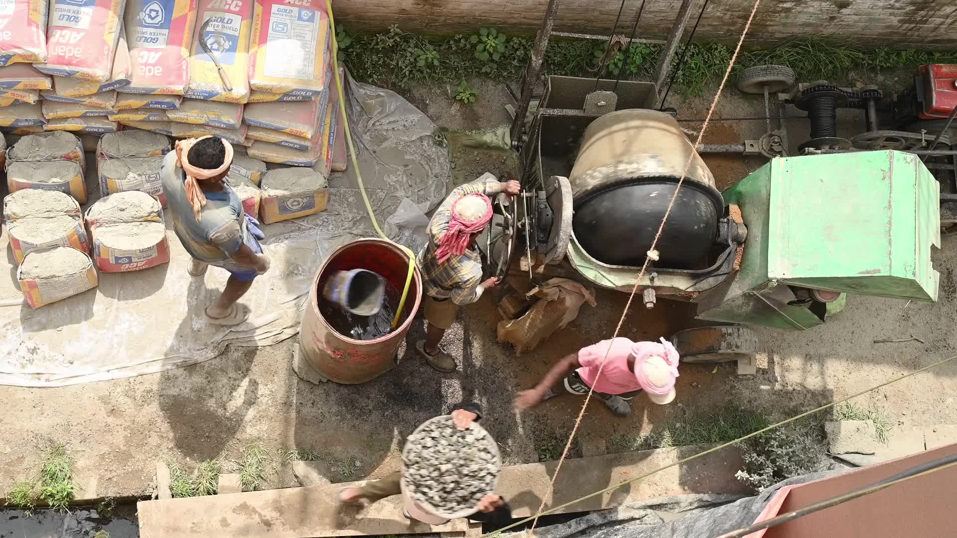 Masonry - Indian Economy - Daily wage labor in India - Concrete roof making in India