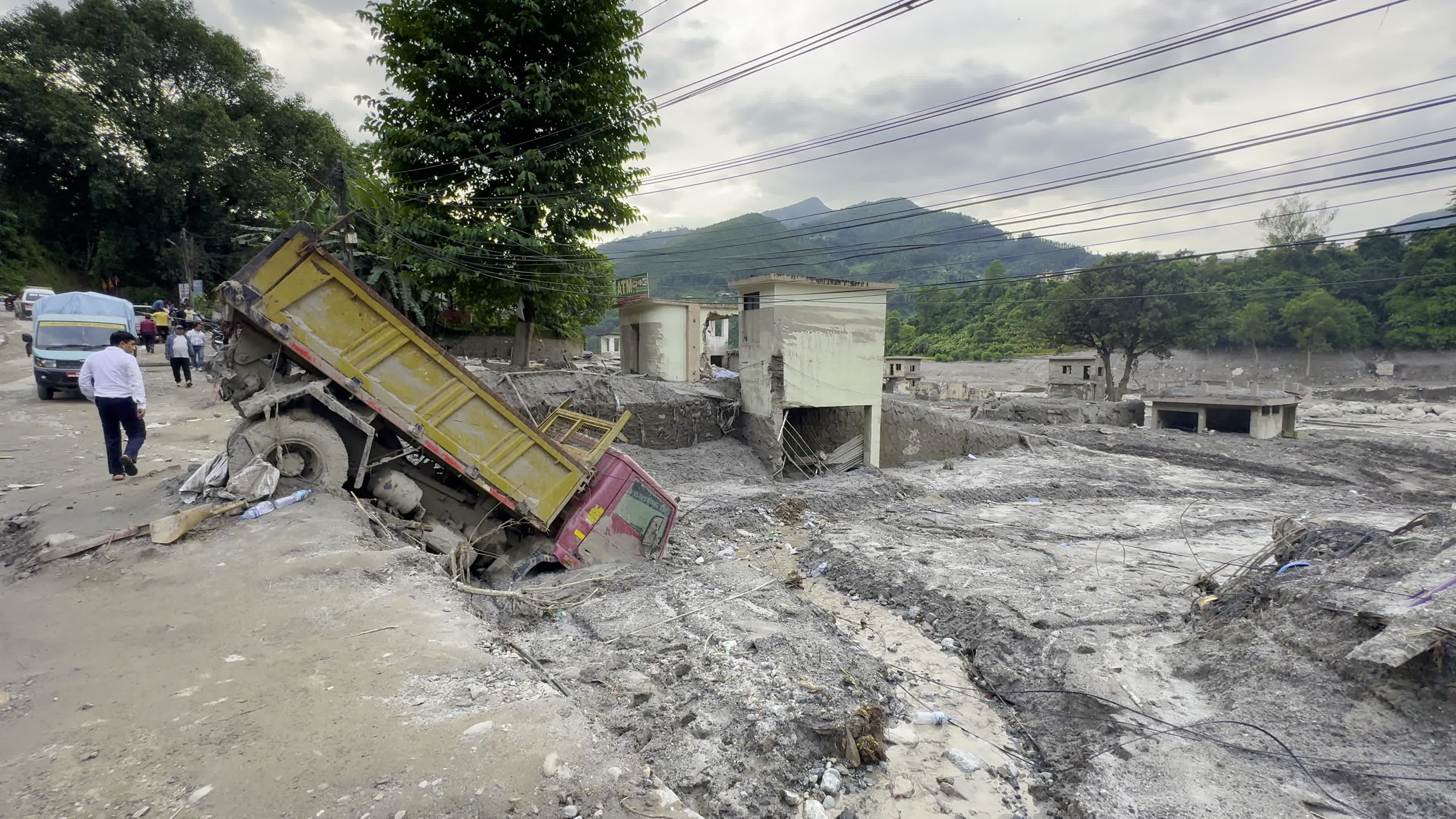 NEPAL: Tipper Truck Submerged in River Mud Following Destructive Trishuli Flash Flood