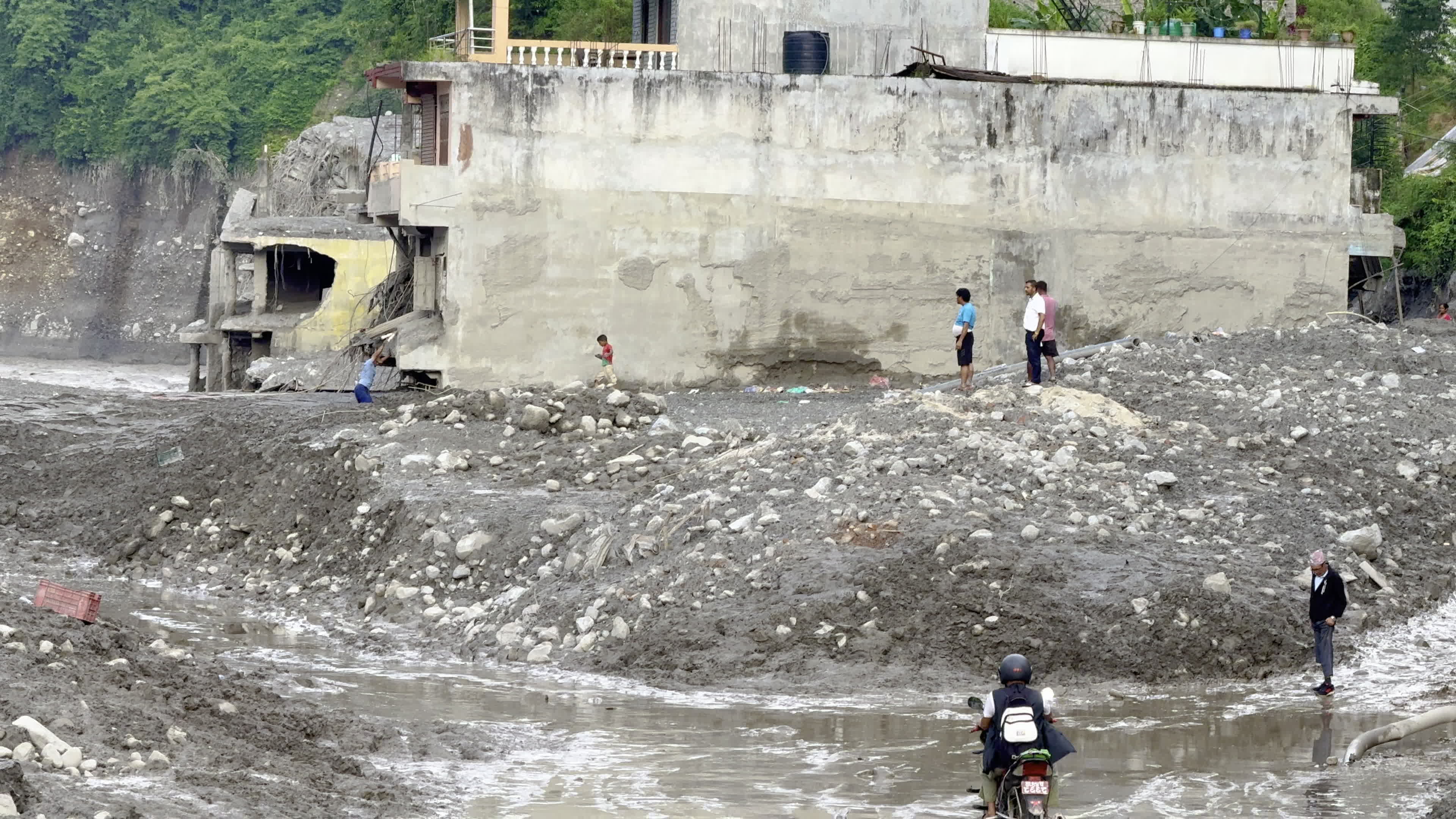 NEPAL: Residential Buildings Buried by Massive Sediment and Boulder Deposits in Trishuli Flash Flood