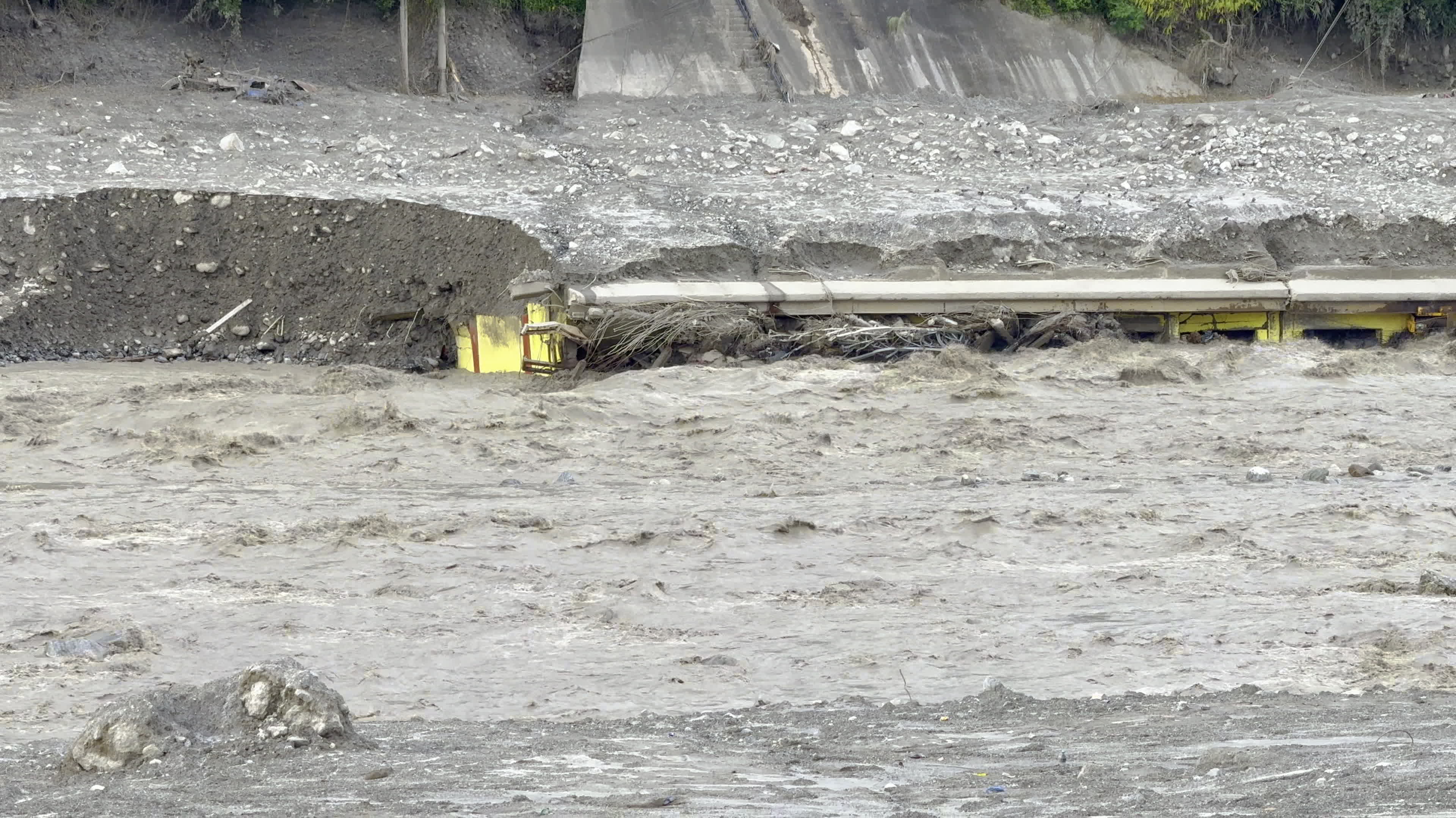 NEPAL: Submerged Bridge Structure and Severe Riverbank Erosion Along Swollen Trishuli River