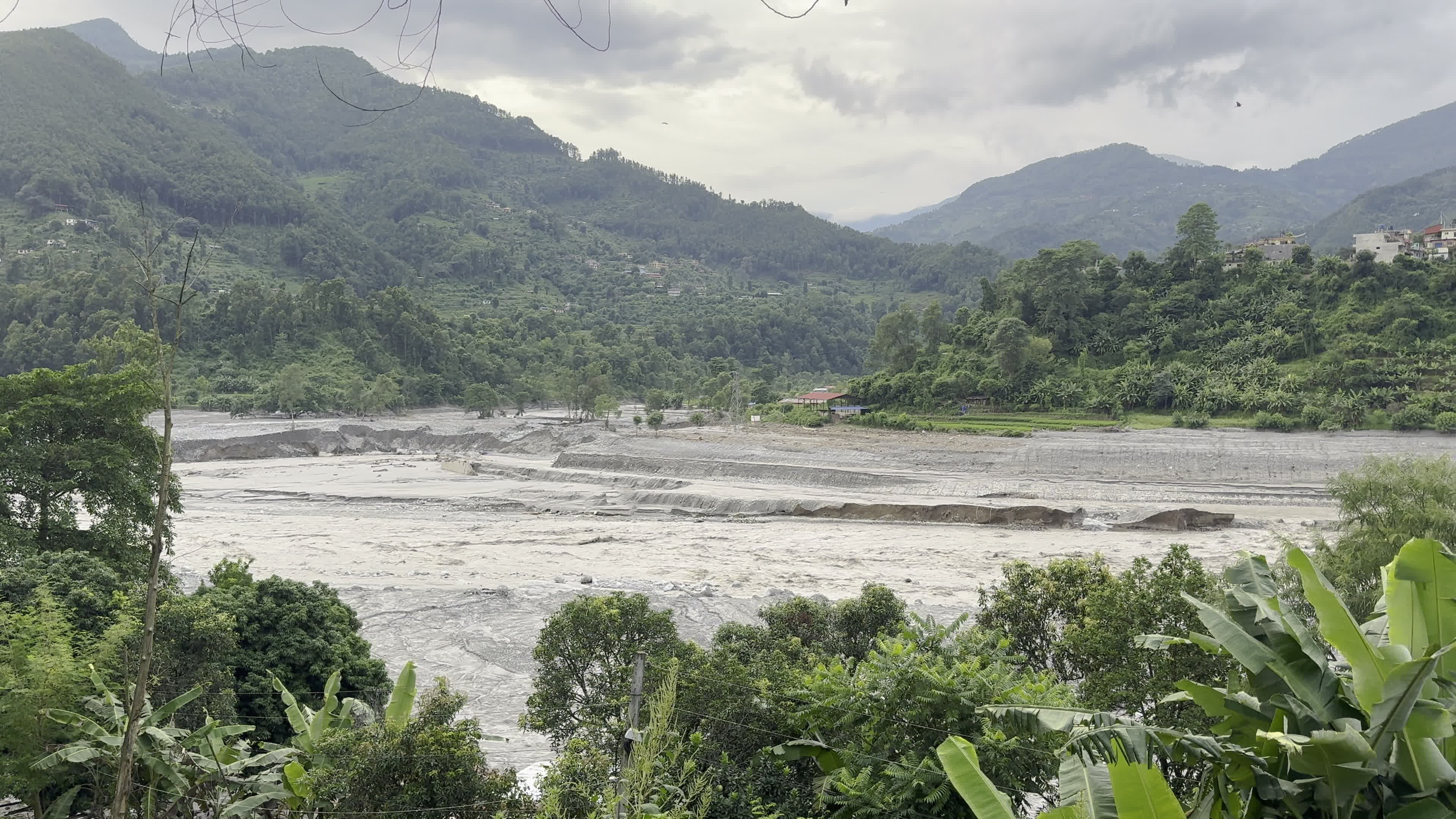 NEPAL: Wide Landscape of Swollen Trishuli River Basin and Flood-Ravaged Valley Terraces
