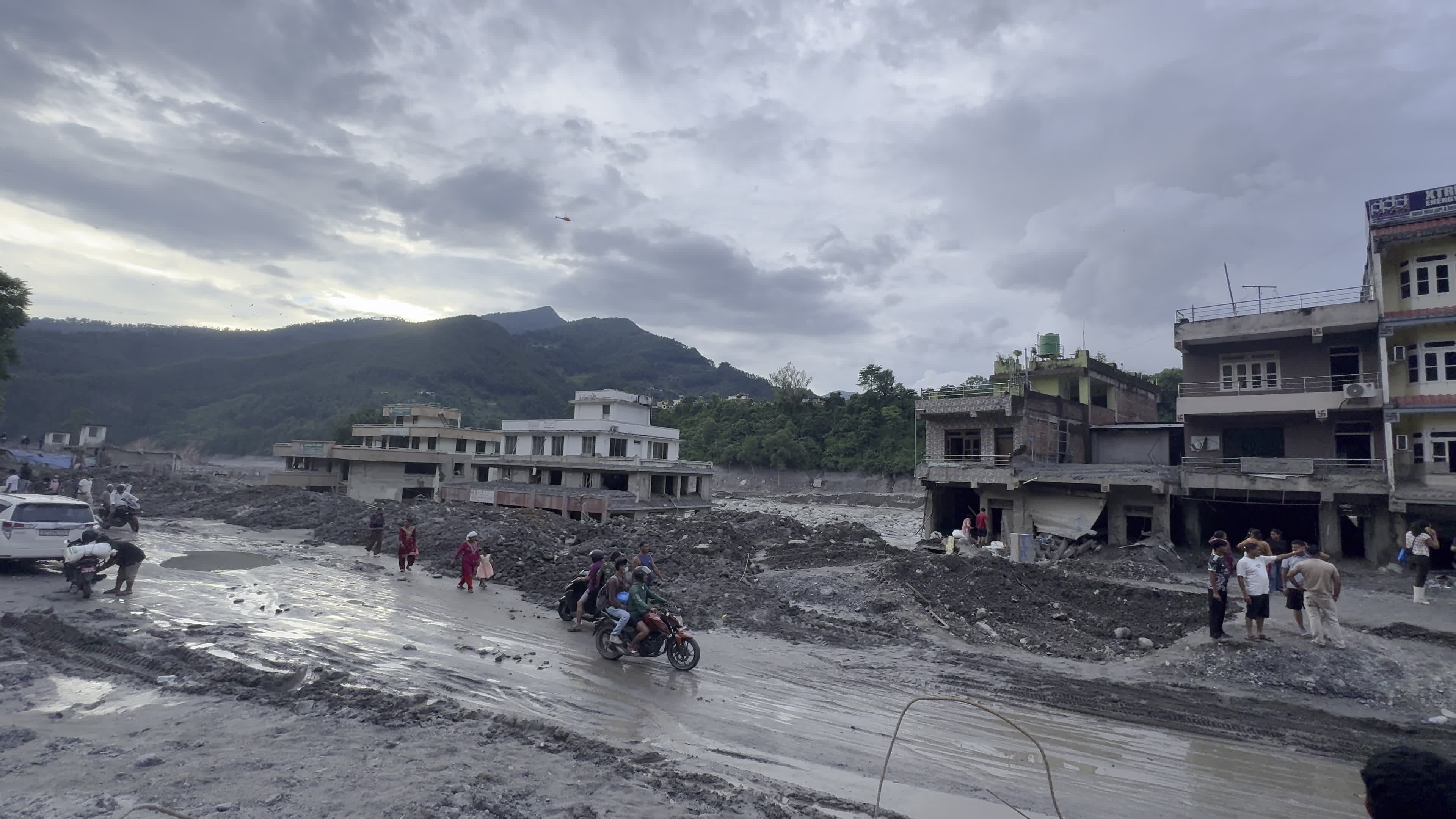 NEPAL: Wide View of Submerged Settlement and Helicopter Operation in Flood-Hit Trishuli Basin