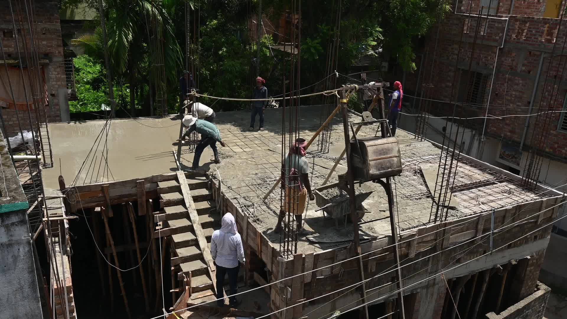 Masonry - Indian Economy - Daily wage labor in India - Concrete roof making in India