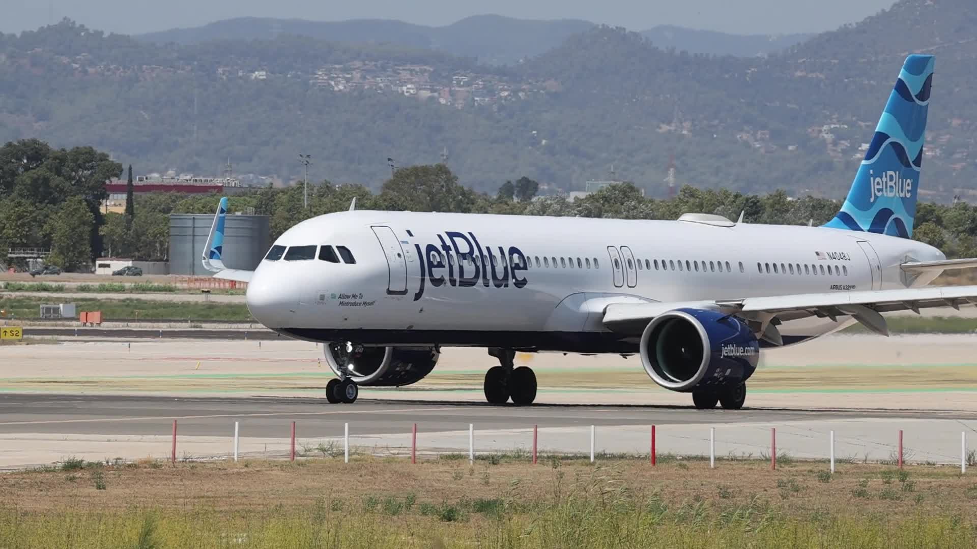A JetBlue Airbus A321 takes off from Barcelona Airport