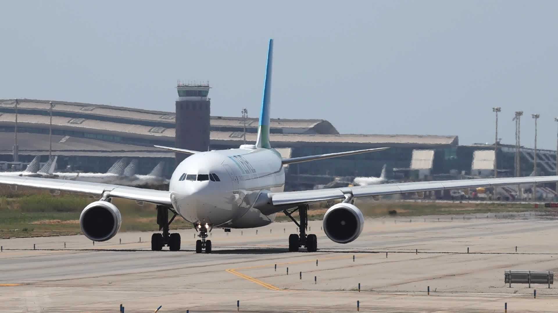 A LEVEL Airbus A330 on the runway at Barcelona Airport