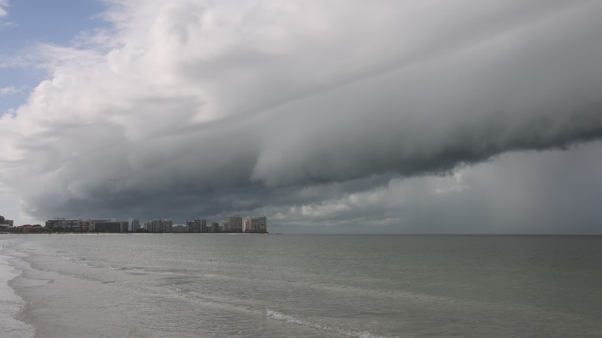 Dark thunderstorm clouds loom over Crescent Beach in Florida