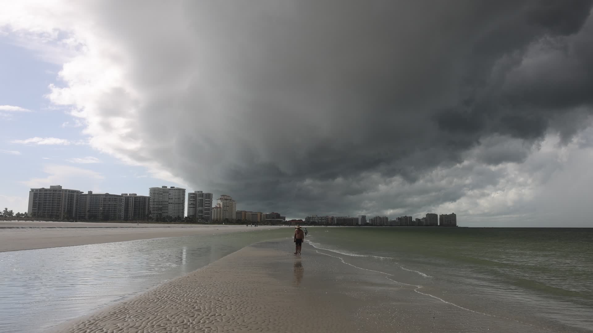 Dark thunderstorm clouds loom over Crescent Beach in Florida