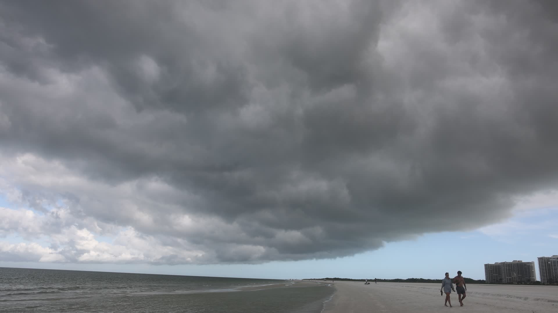 Dark thunderstorm clouds loom over Crescent Beach in Florida