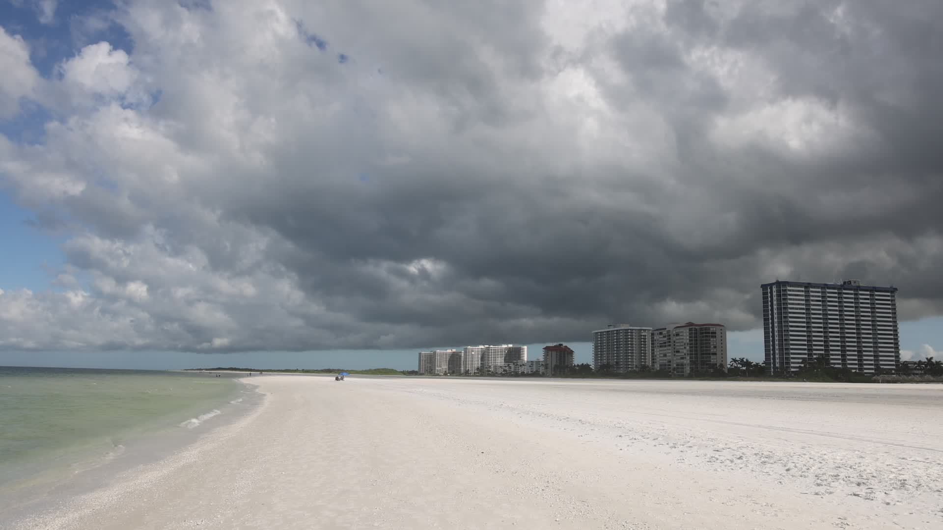 Dark thunderstorm clouds loom over Crescent Beach in Florida