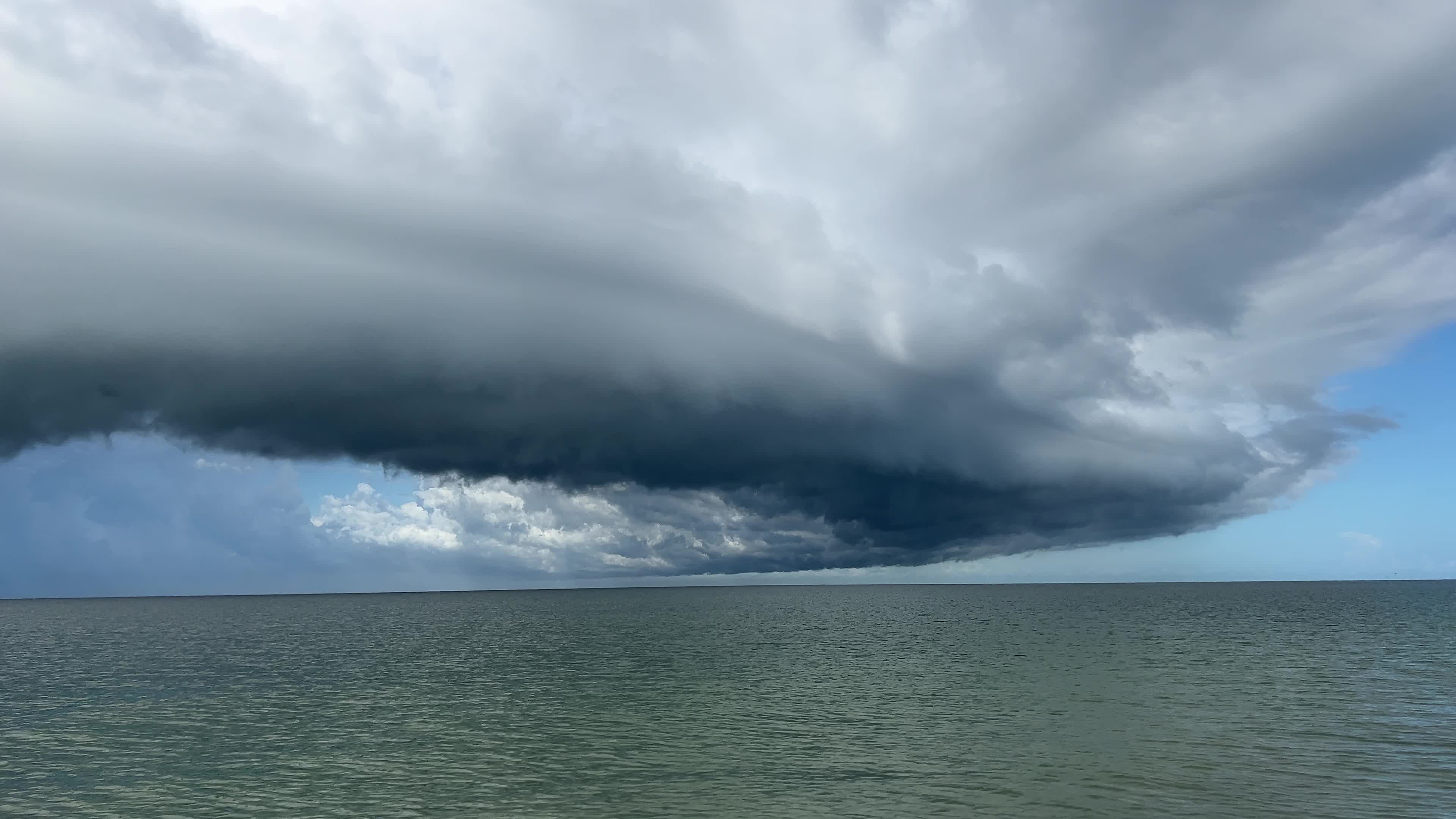 Dark thunderstorm clouds loom over Crescent Beach in Florida