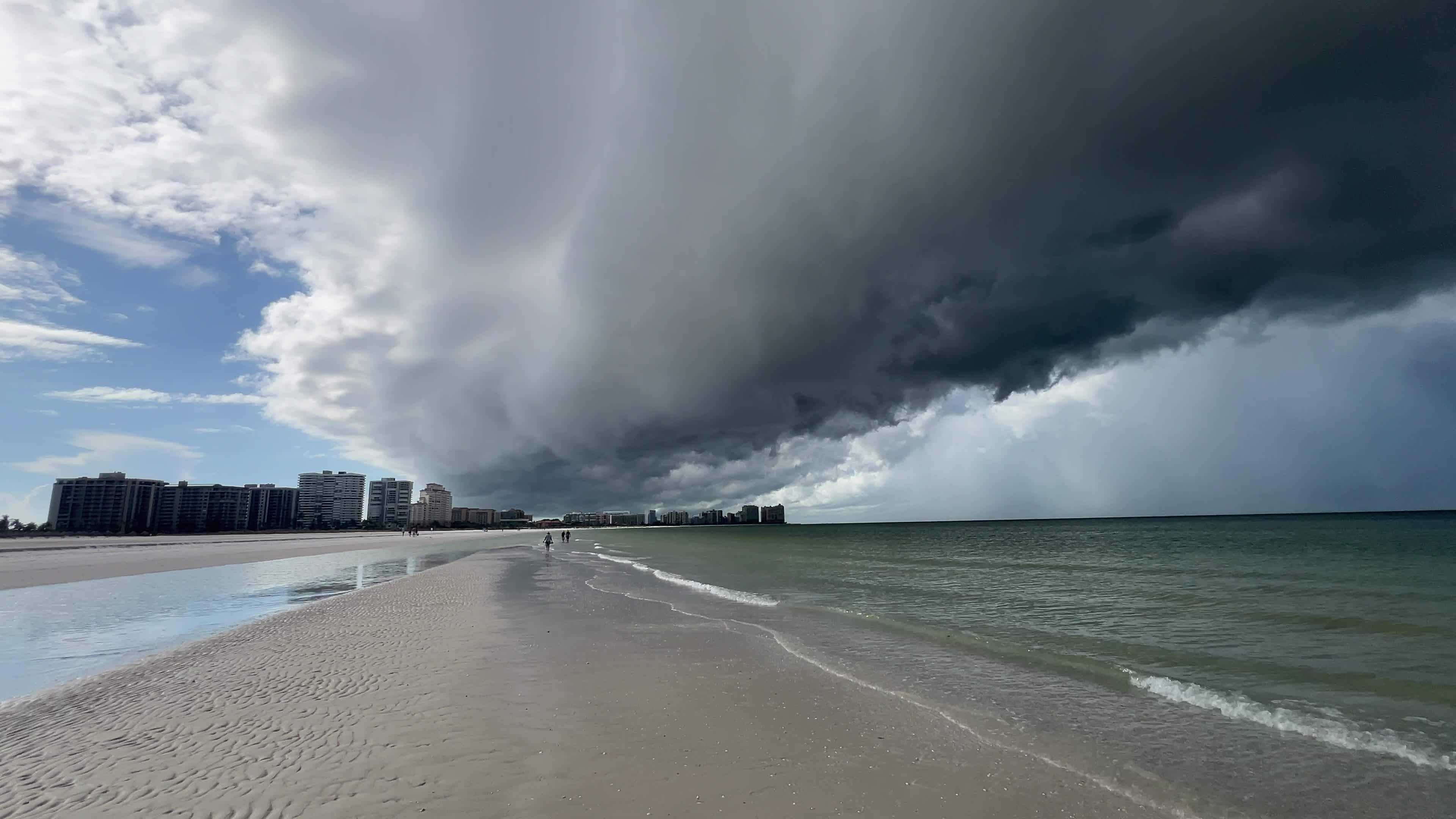 Dark thunderstorm clouds loom over Crescent Beach in Florida