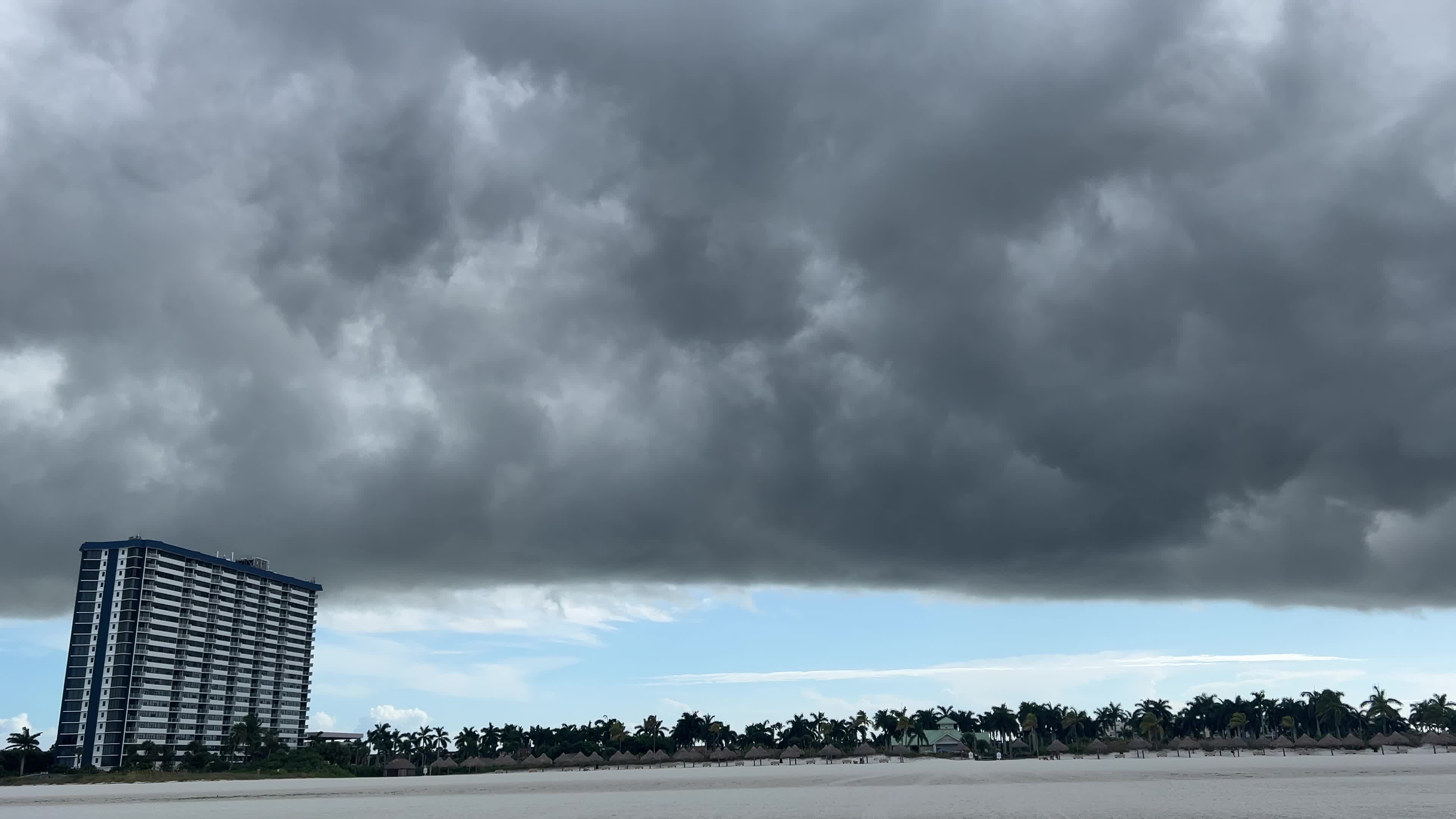 Dark thunderstorm clouds loom over Crescent Beach in Florida