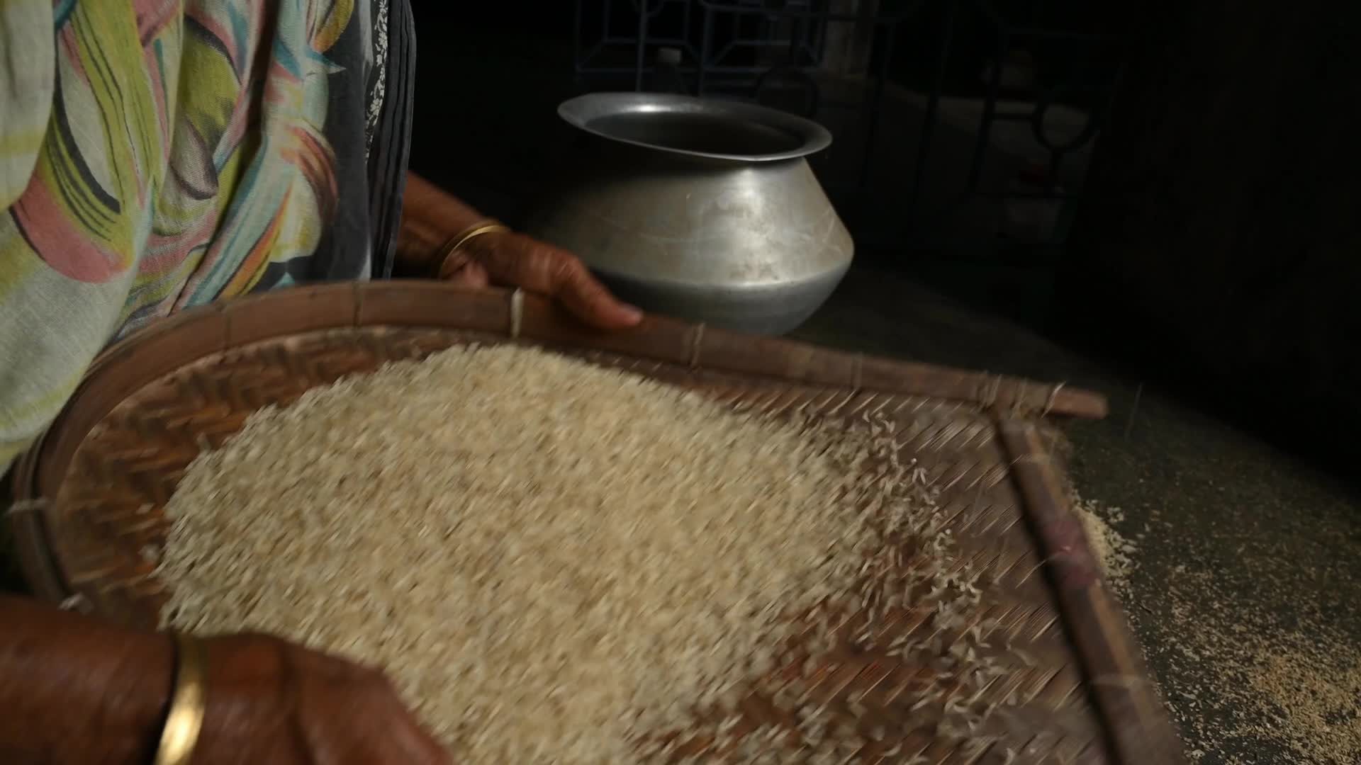 Rice winnowing - Traditional rice processing - Parboiled rice production in India
