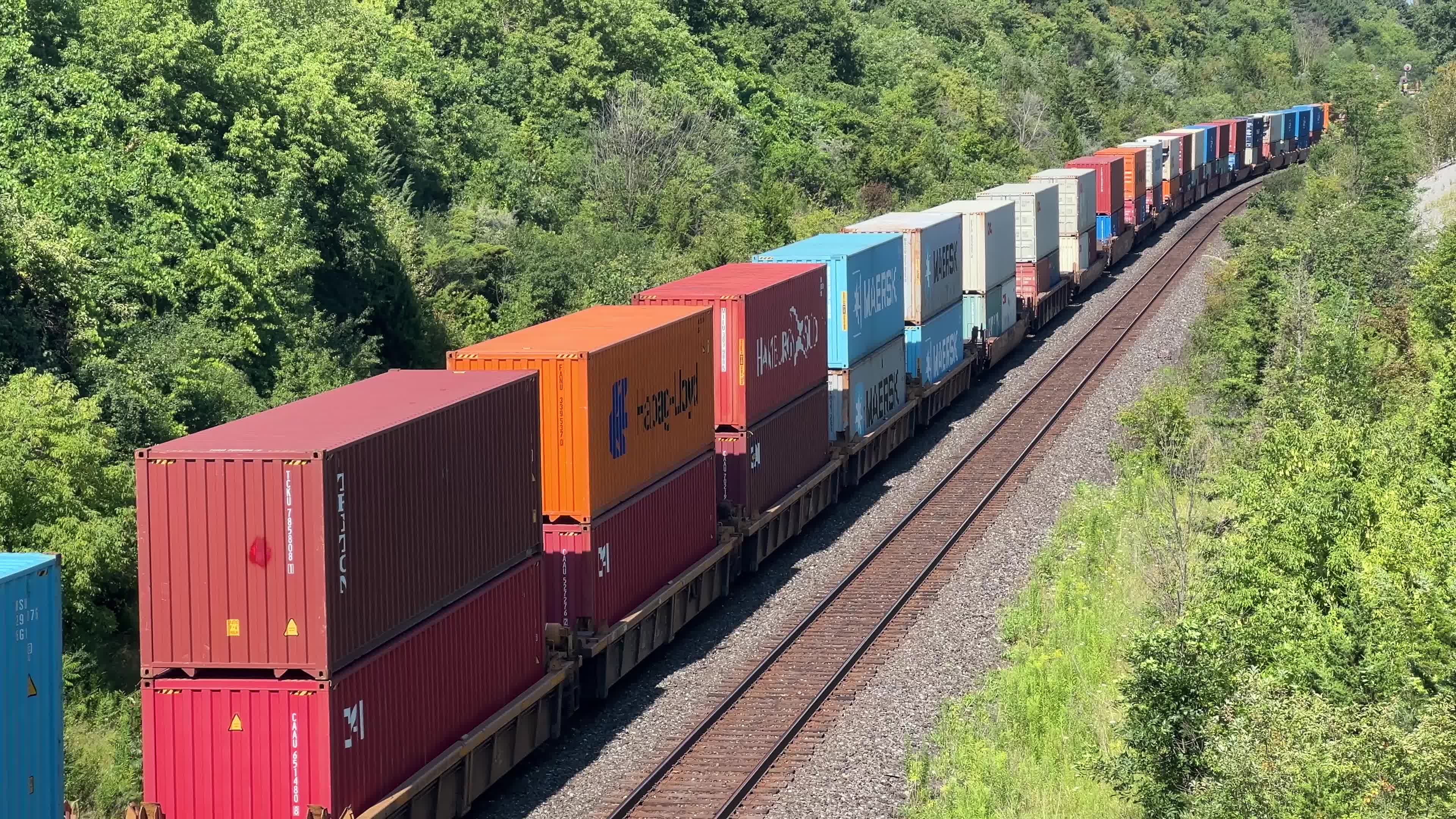 Train carrying stacked intermodal shipping containers