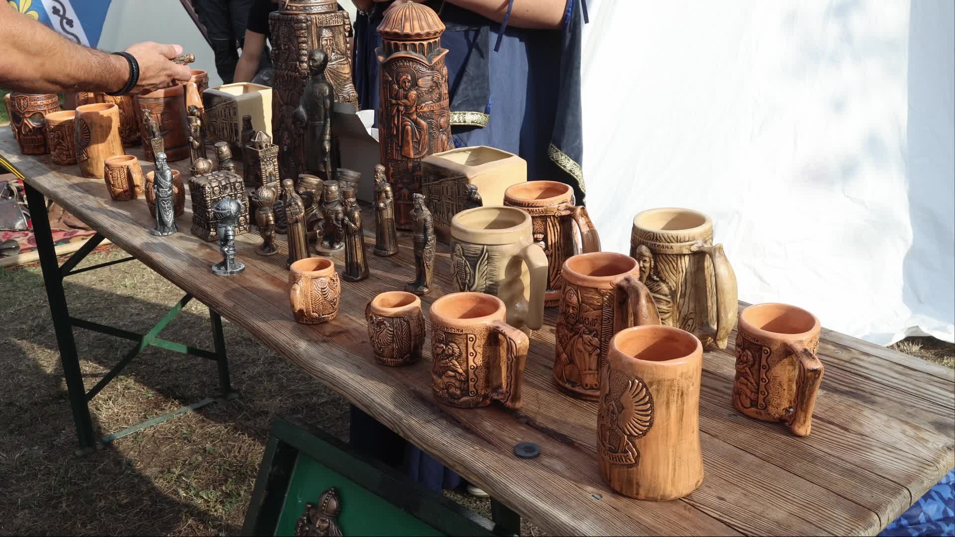 Sale of Traditional Serbian Figurines and Mugs in Novi Sad, Serbia