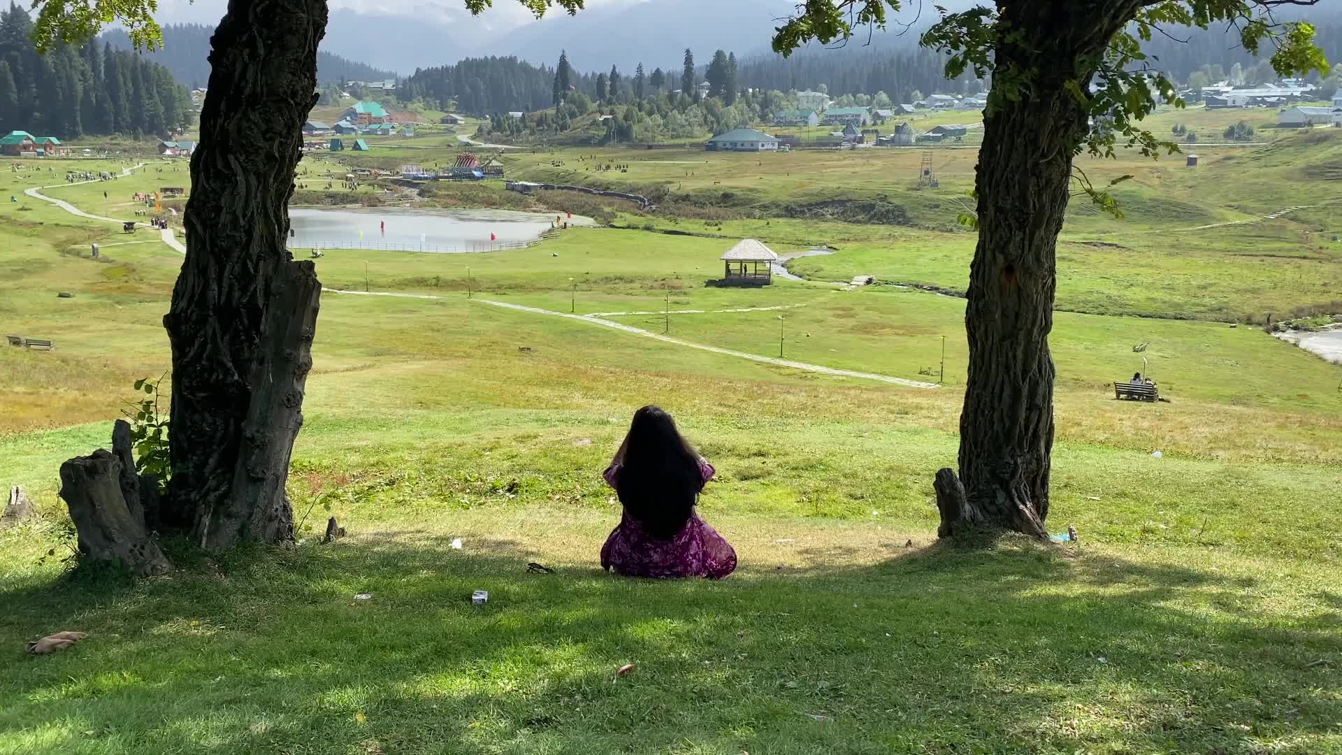 A woman sit in a park at tourist destination in Gulmarg on Saturday, 26 September 2026.