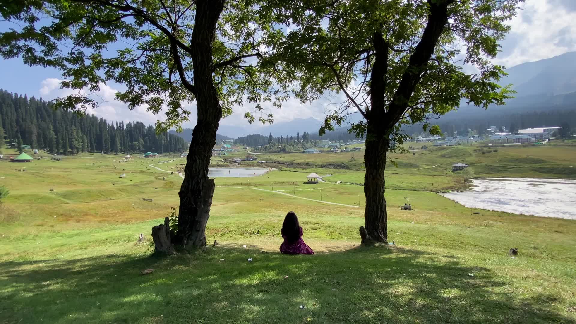 A woman sit in a park at tourist destination in Gulmarg on Saturday, 26 September 2026.