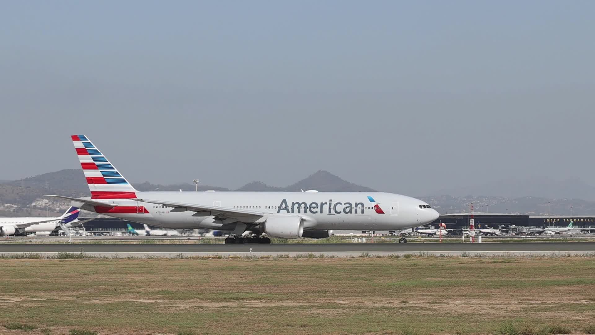 An American Airlines Boeing 777 prepares for takeoff from Barcelona Airport