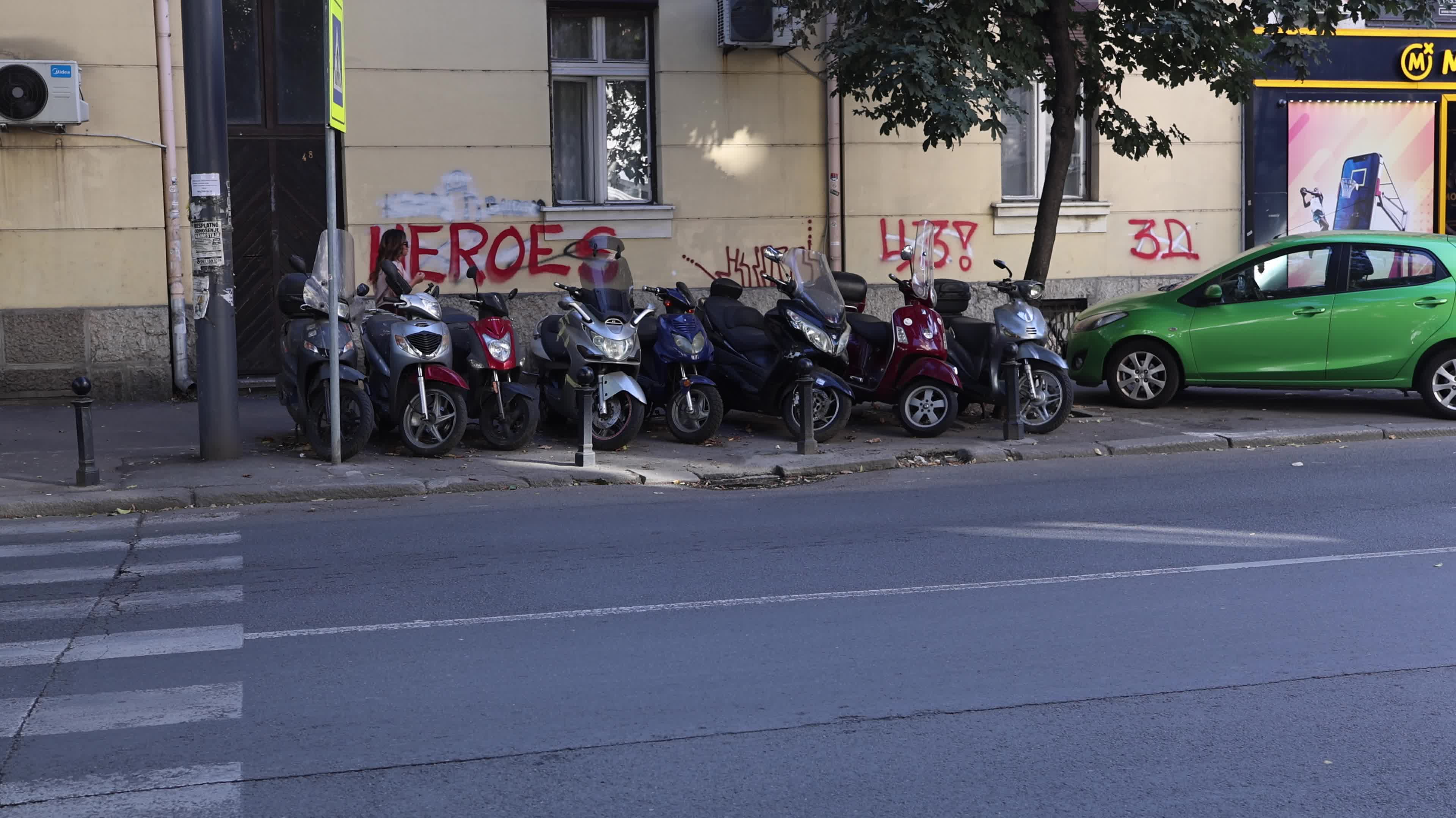 Broken Scooters Outside Repair Shop in Serbia