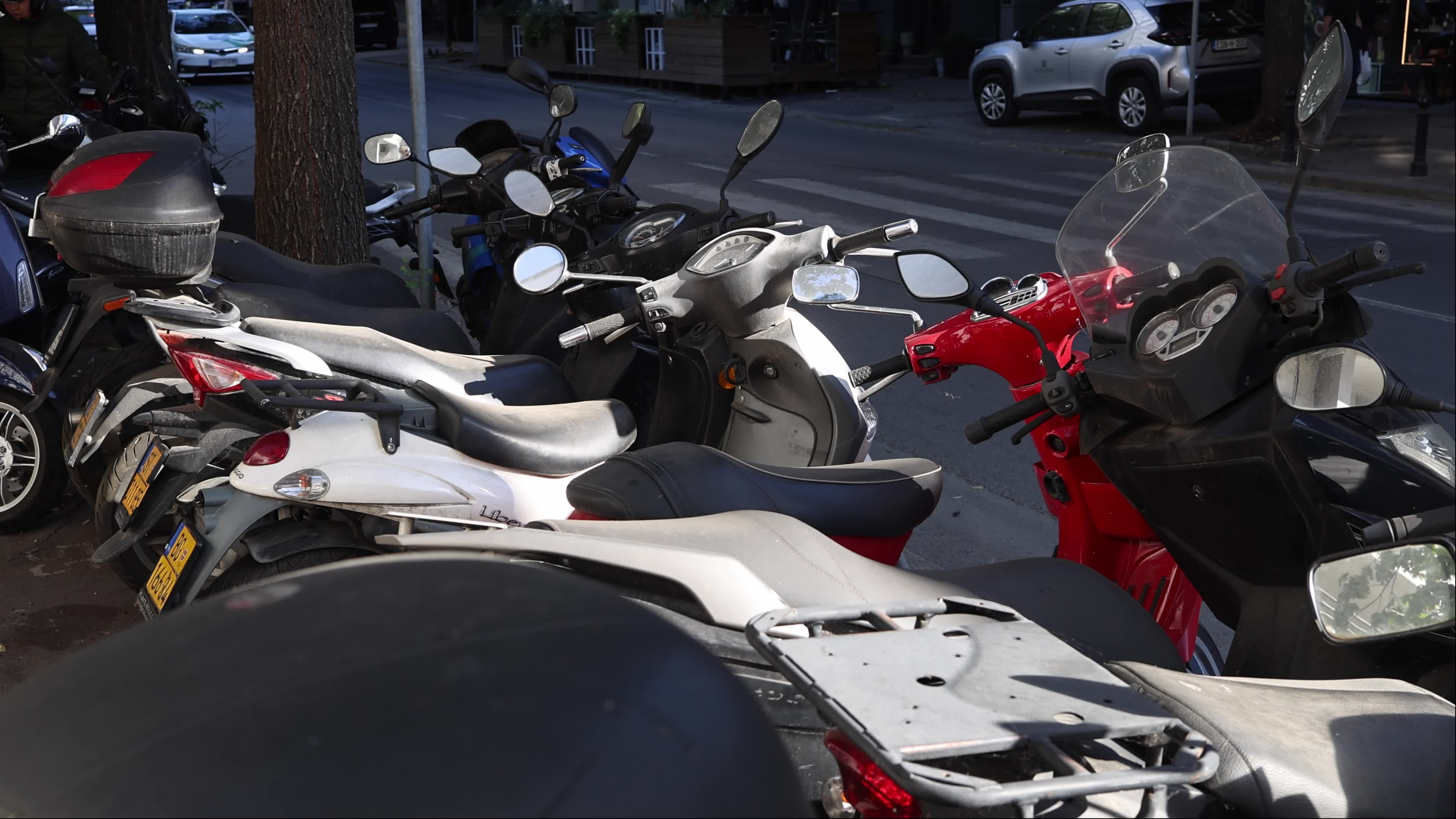 Broken Scooters Outside Repair Shop in Serbia